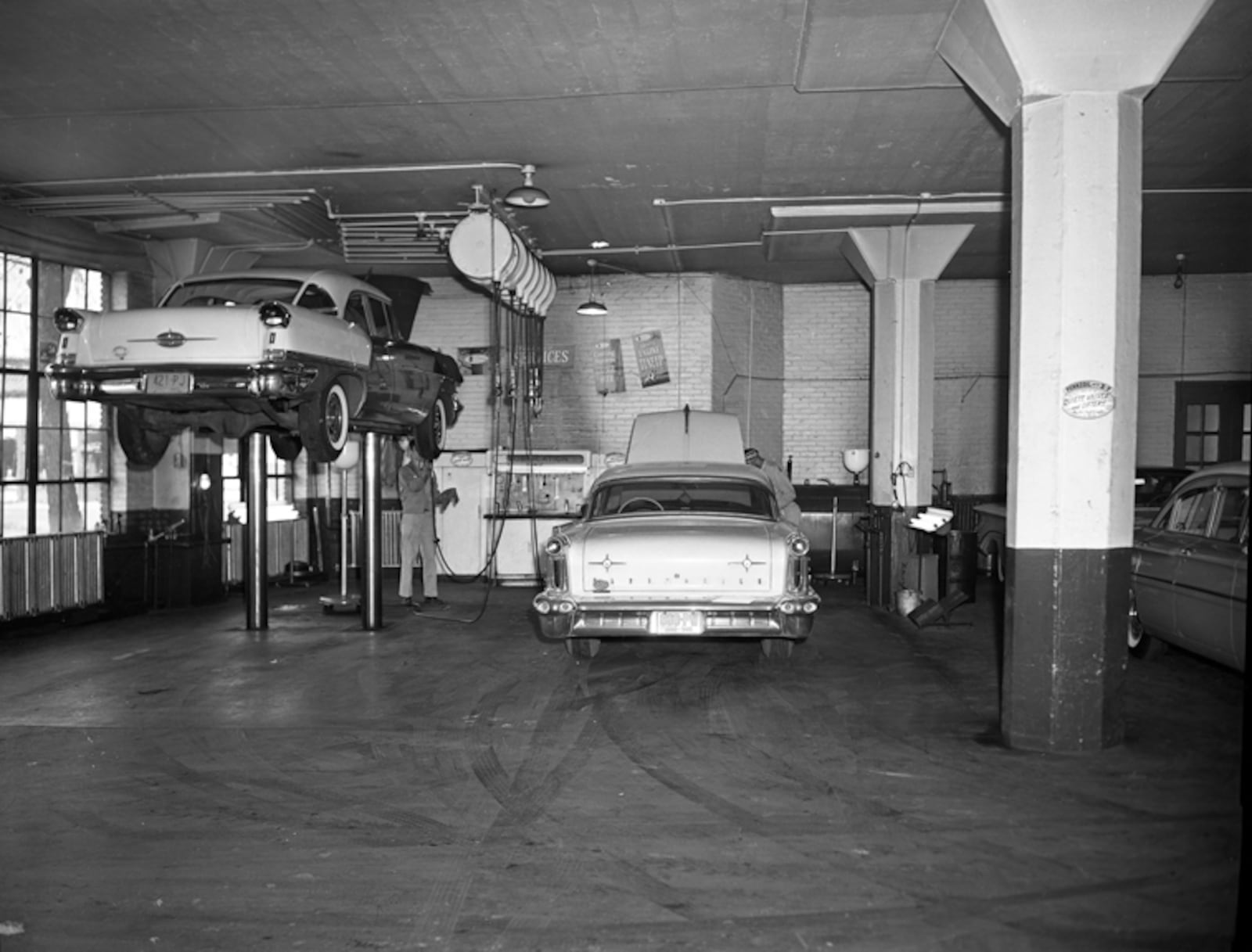 Cars inside the Central Motors Building, November 2, 1960. From the collections of Dayton History.