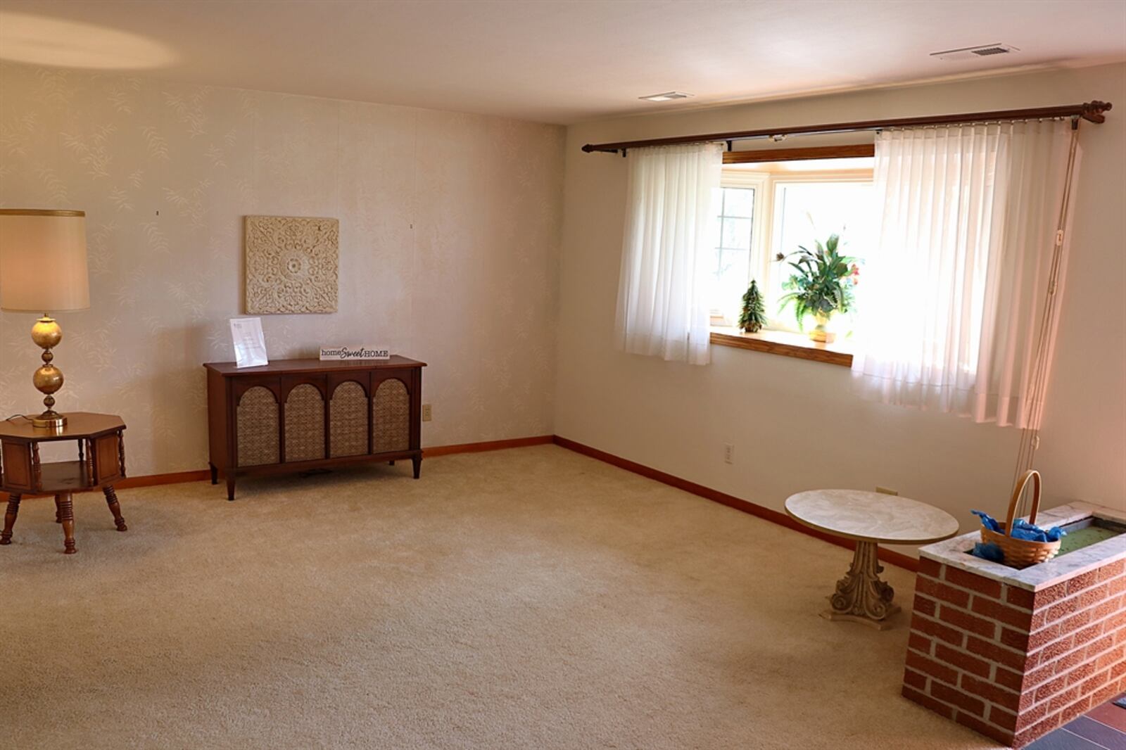 A bay window fills the formal living room with natural light. 