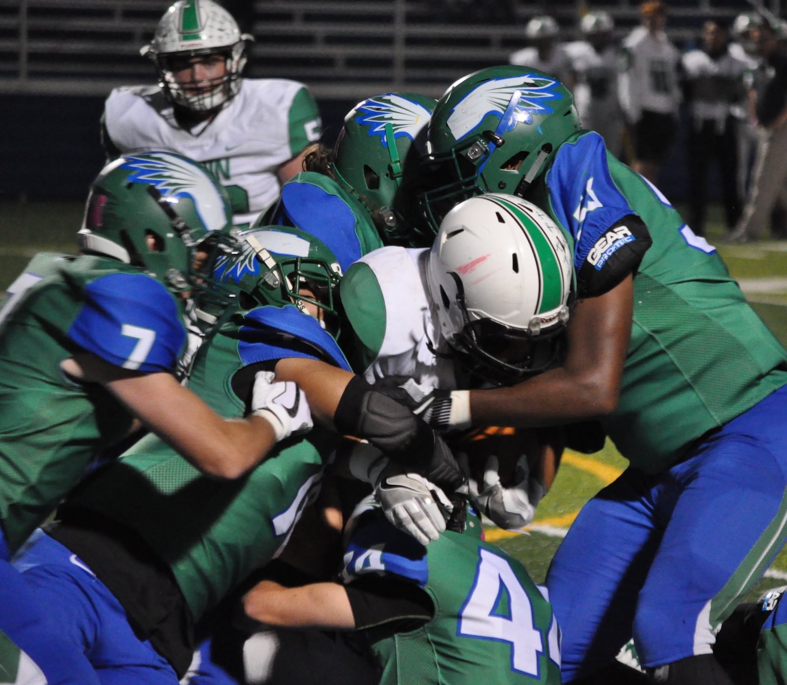 Badin’s Lavassa Martin finds himself surrounded by Chaminade Julienne defenders Friday night at Roger Glass Stadium in Dayton. CONTRIBUTED PHOTO BY NICK DUDUKOVICH