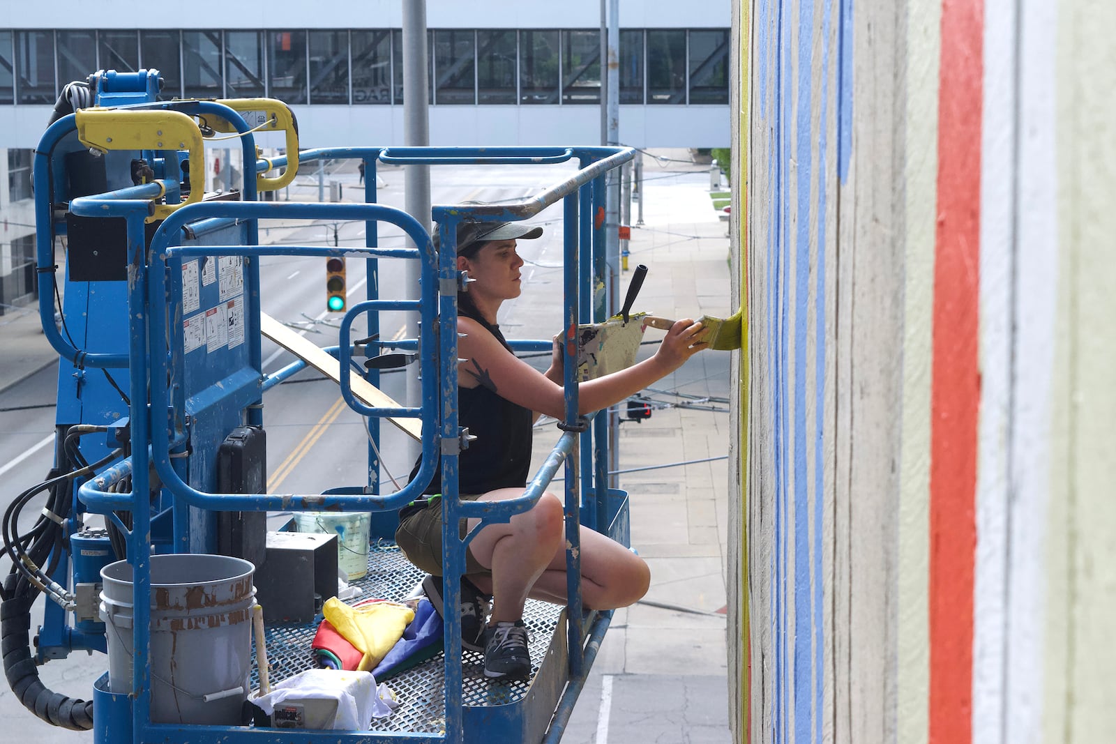 A new artwork, created by artist Atalie Gagnet, has been completed on the Dayton Transportation Center garage. CHEYANNE LUMPKIN / CONTRIBUTING PHOTOGRAPHER