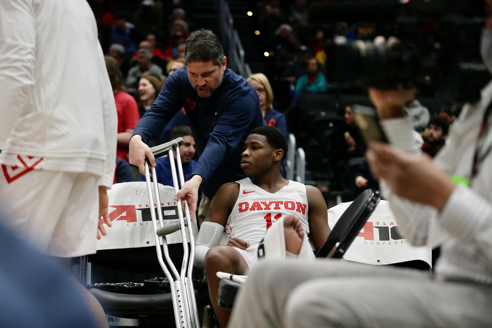 Dayton's Malachi Smith sits on the bench in the second half after suffering an injury on the final play of the first half against Richmond in the semifinals of the Atlantic 10 Conference tournament on Saturday, March 12, 2022, at Capital One Arena in Washington, D.C. David Jablonski/Staff