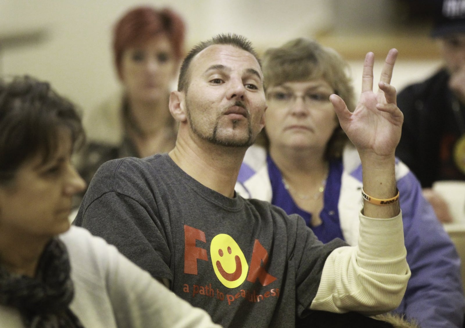 When he was using heroin, Tyler Walters said he took precautions — including saying a little prayer — to make sure he didn’t overdose on the strong fentanyl-laced heroin that flooded the Dayton region beginning last fall. Clean since July, Walters, at center, attends a Families of Addicts meeting Wednesday night in Oakwood. CHRIS STEWART / STAFF