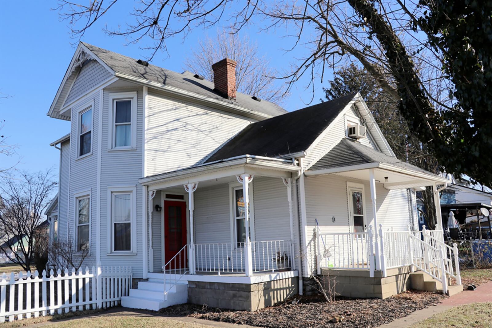 A carriage house has 3 overhead doors plus loft storage and office space. Extra parking is off the side street to the overhead doors of the carriage house. CONTRIBUTED PHOTO BY KATHY TYLER