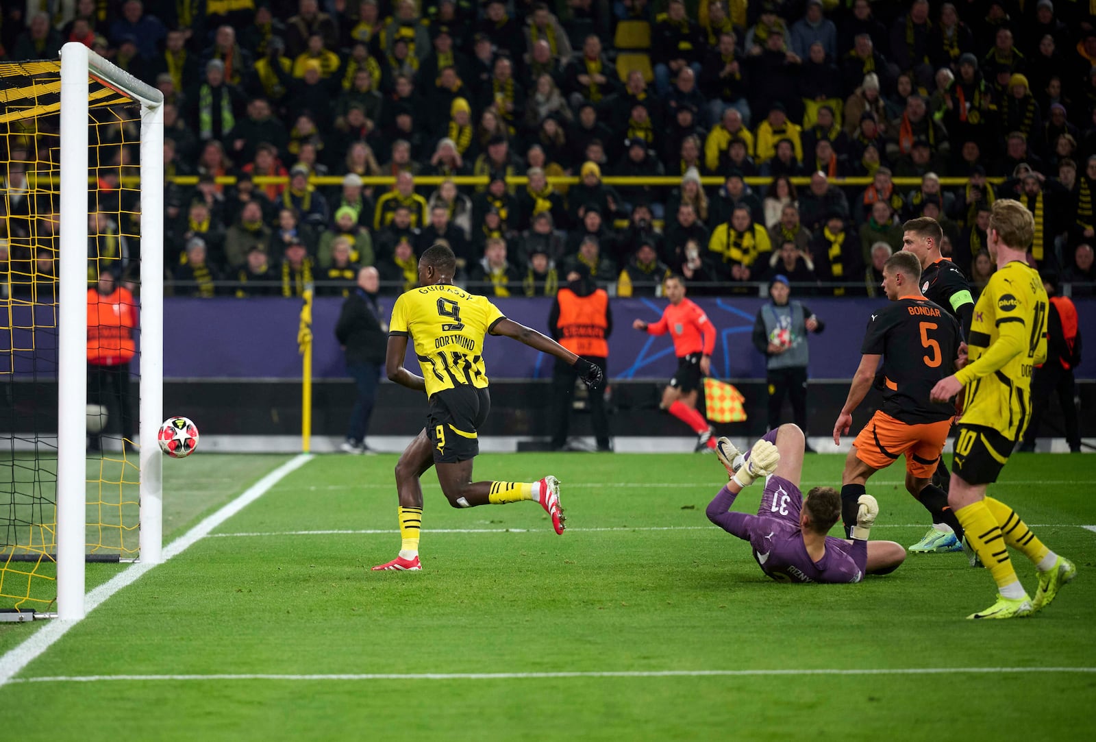 Dortmund's Serhou Guirassy scores the opening goal during the Champions League opening phase soccer match between Borussia Dortmund and Shakhtar Donetsk in Dortmund, Germany, Jan. 29, 2025. (Bernd Thissen/dpa via AP)