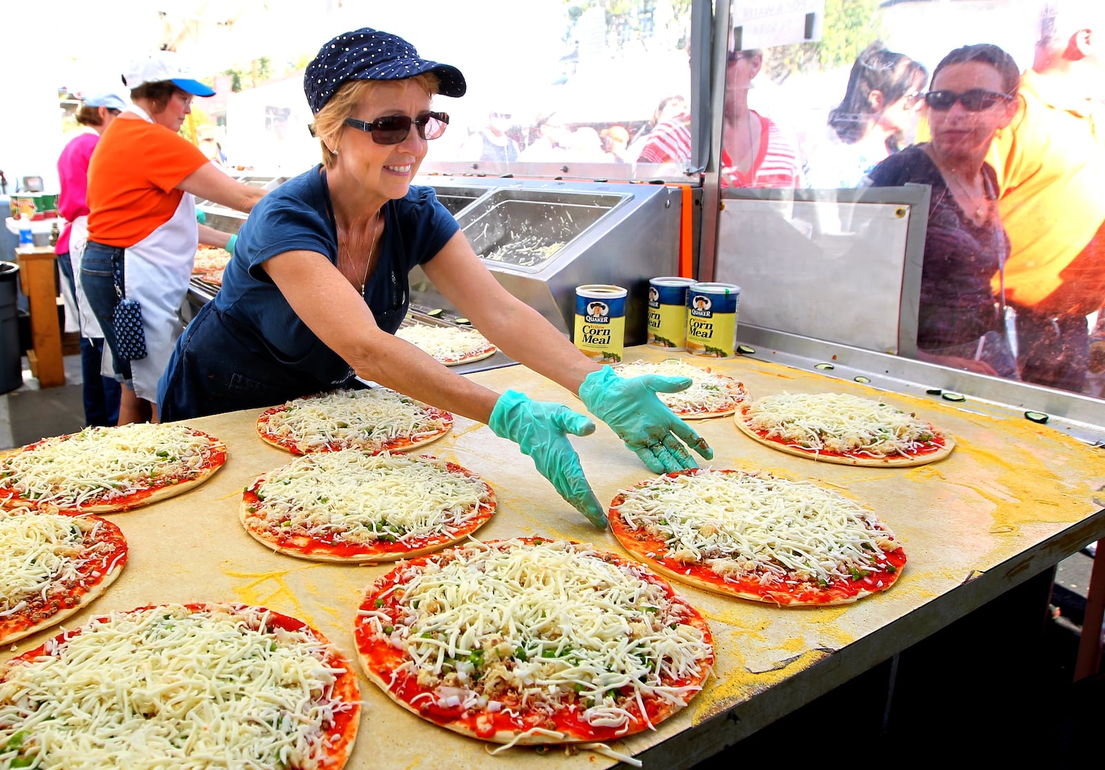 Sauerkraut pizza is one of the local delicacies peddled at the Ohio Sauerkraut Festival in Waynesville. STAFF/NICK DAGGY