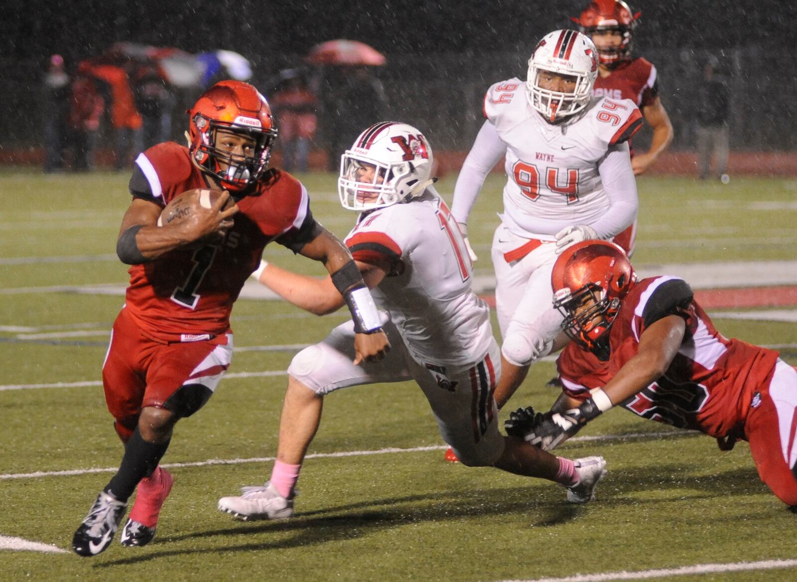 Trotwood RB Ra'veion Hargrove gets a step on Wayne's Jack Morgan-Elliott. Trotwood-Madison defeated visiting Wayne 14-7 in a Week 10 GWOC crossover high school football game to complete a 10-0 regular season on Friday, Oct. 27, 2017. MARC PENDLETON / STAFF