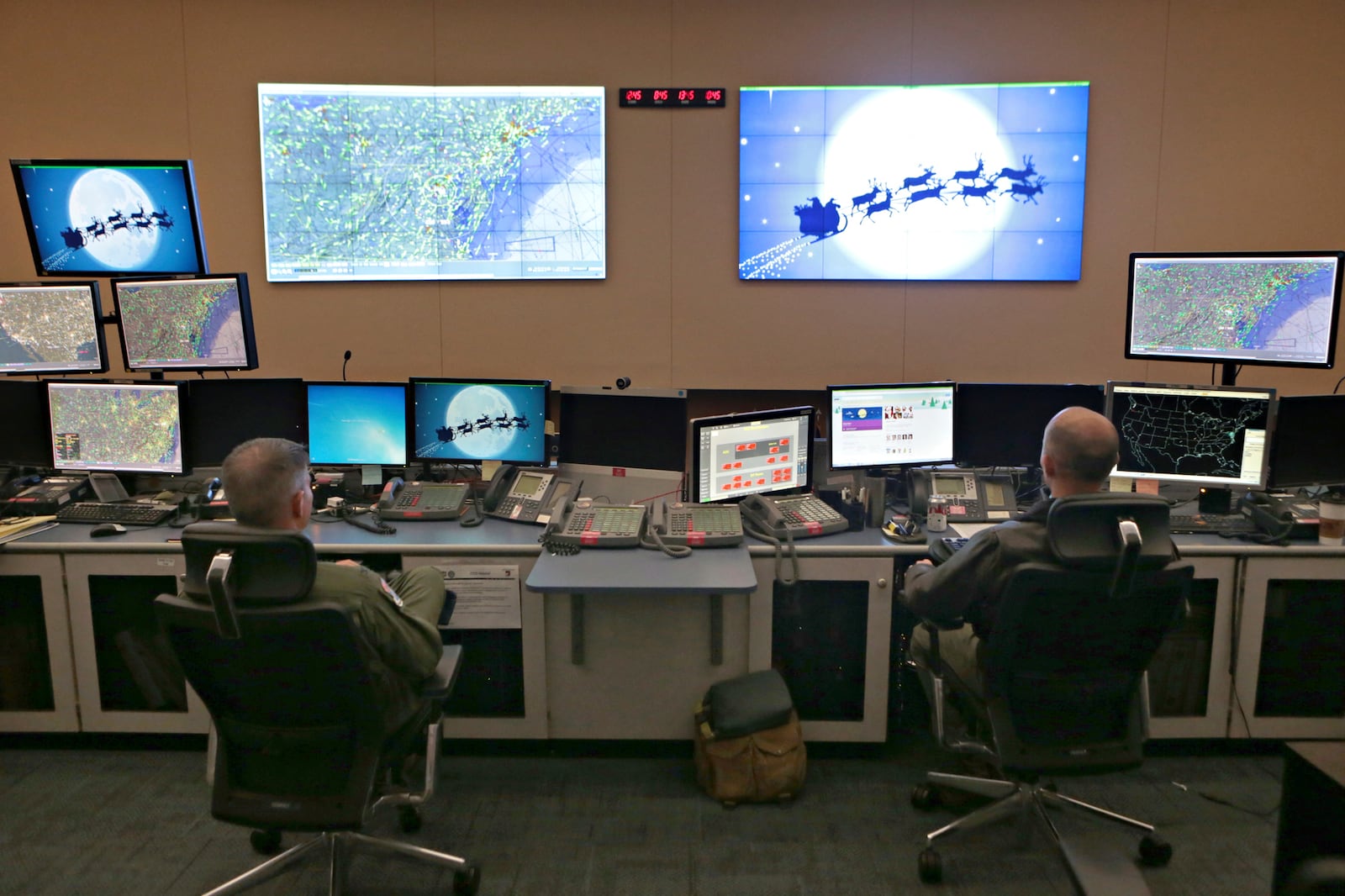 Members of the 601st Air Operations Center will watch Santa fly around the world on Christmas Eve with their NORAD Santa tracker on Friday, Dec. 23, 2016 in Panama City, Fla. (Heather Howard/News Herald via AP)