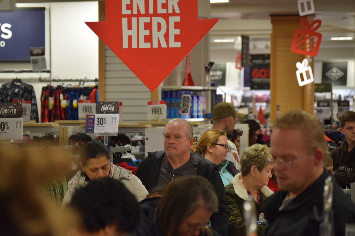 PHOTOS: Hundreds like up outside JCPenney for doorbusters, coupons