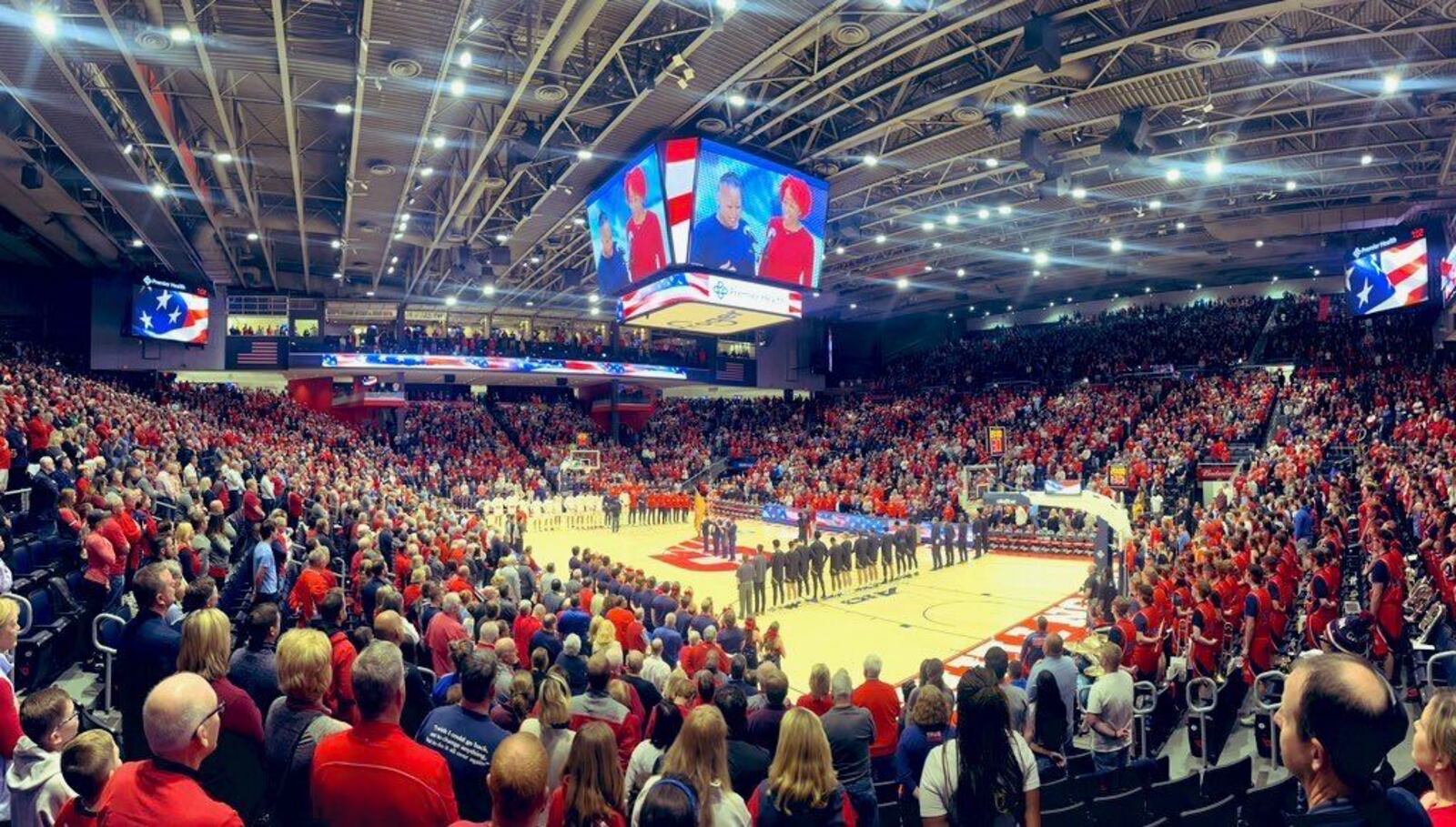 Dayton and Lindenwood stand for the national anthem before their game on Monday, Nov. 7, 2022, at UD Arena. David Jablonski/Staff