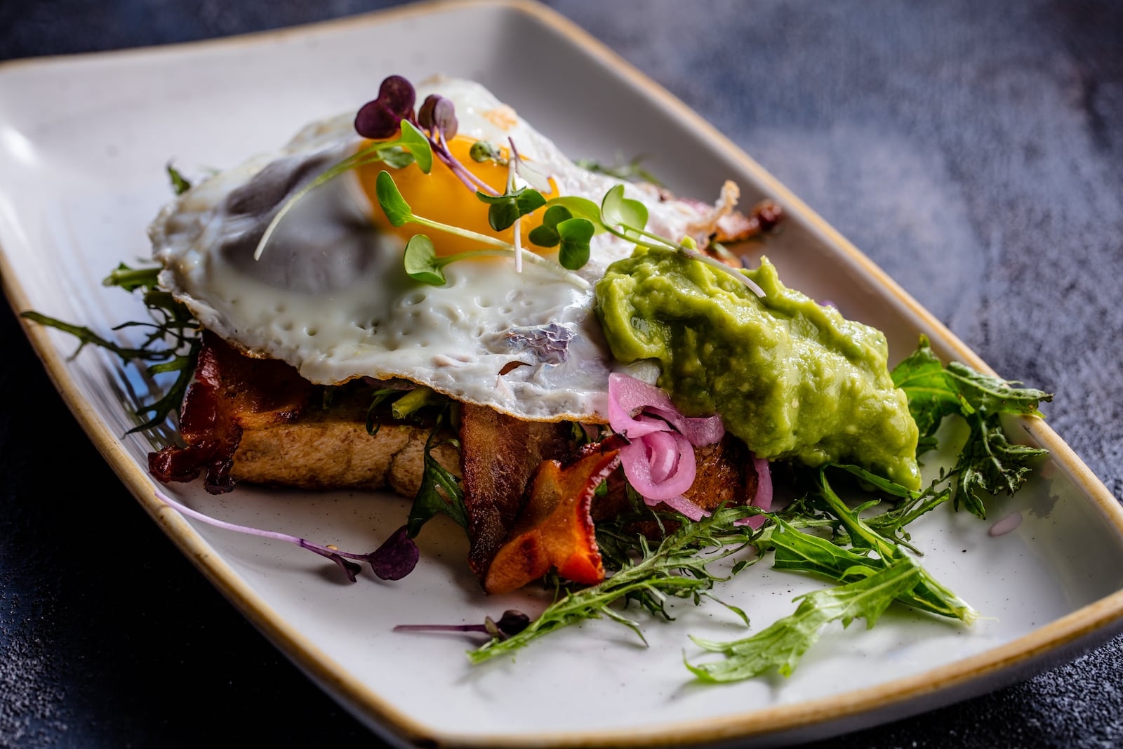 Egg-celling at toast: At The Cooper in Palm Beach Gardens, the avocado toast is no plain thing. LibbyVision.com