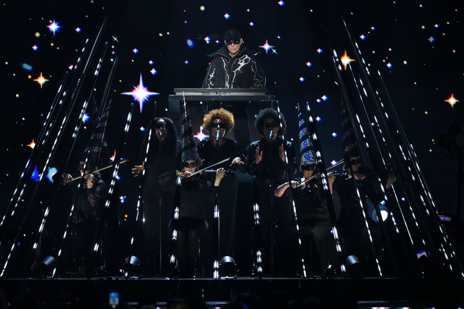 Chris Lowe from the 'Pet Shop Boys' perform alongside the Manchester Camerata during the MTV European Music Awards in Manchester, England, Sunday, Nov. 10, 2024. (Scott A Garfitt/Invision/AP)