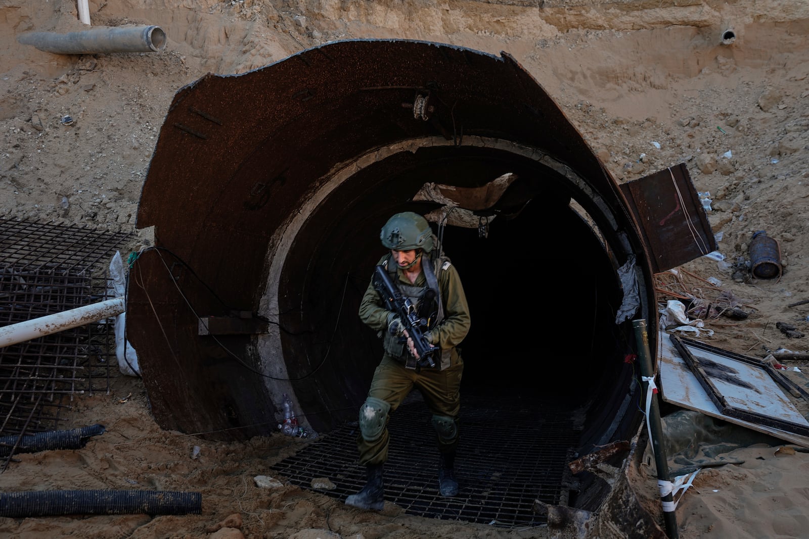 FILE - Israeli soldiers exit a tunnel that the military says Hamas militants used to attack the Erez crossing in the northern Gaza Strip, Friday, Dec. 15, 2023. (AP Photo/Ariel Schalit, File)