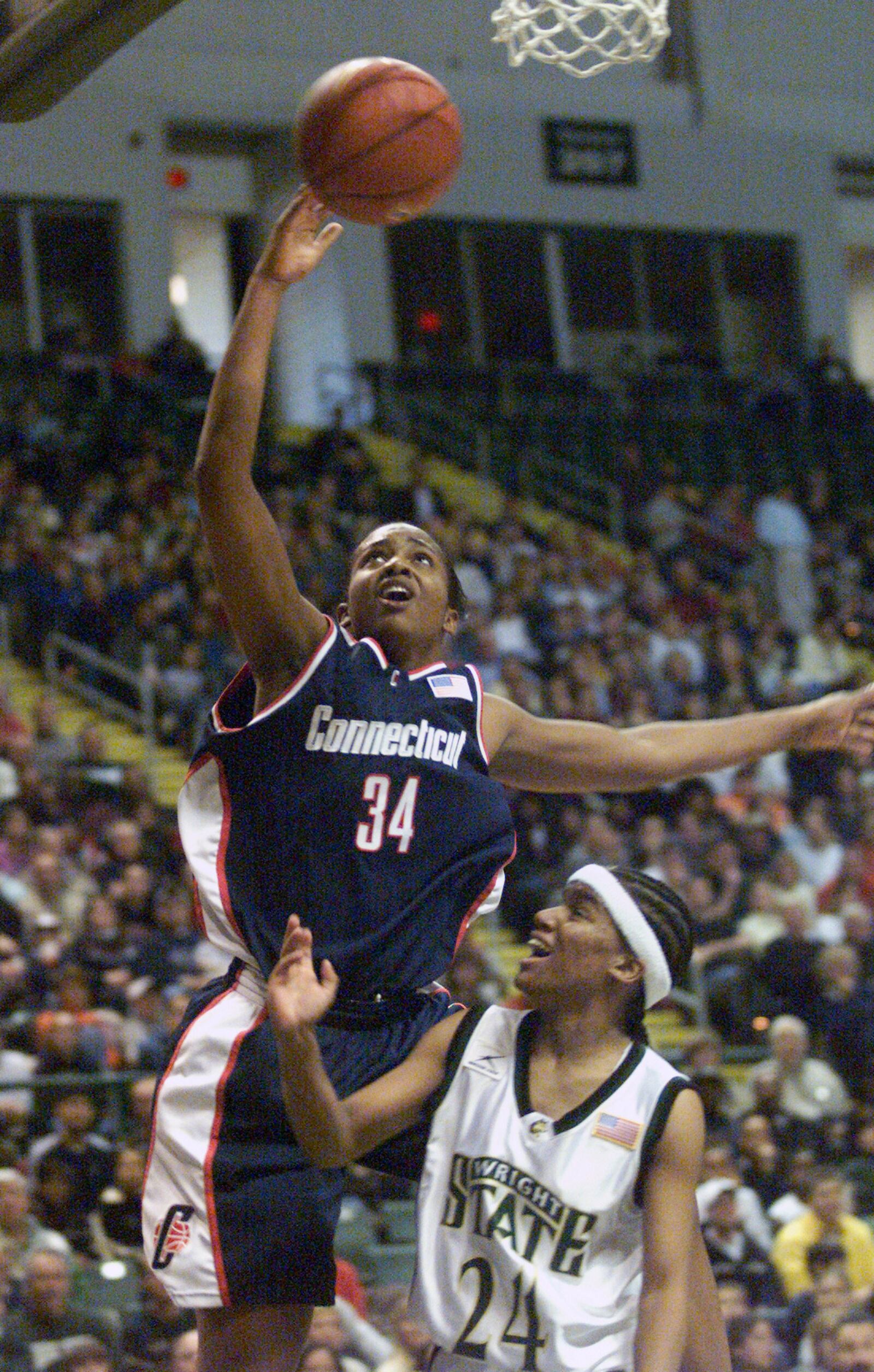 Former Chaminade-Julienne standout Tamika Williams takes it to the hoop over Wright State's Vanessa Thompson at the Nutter Center.