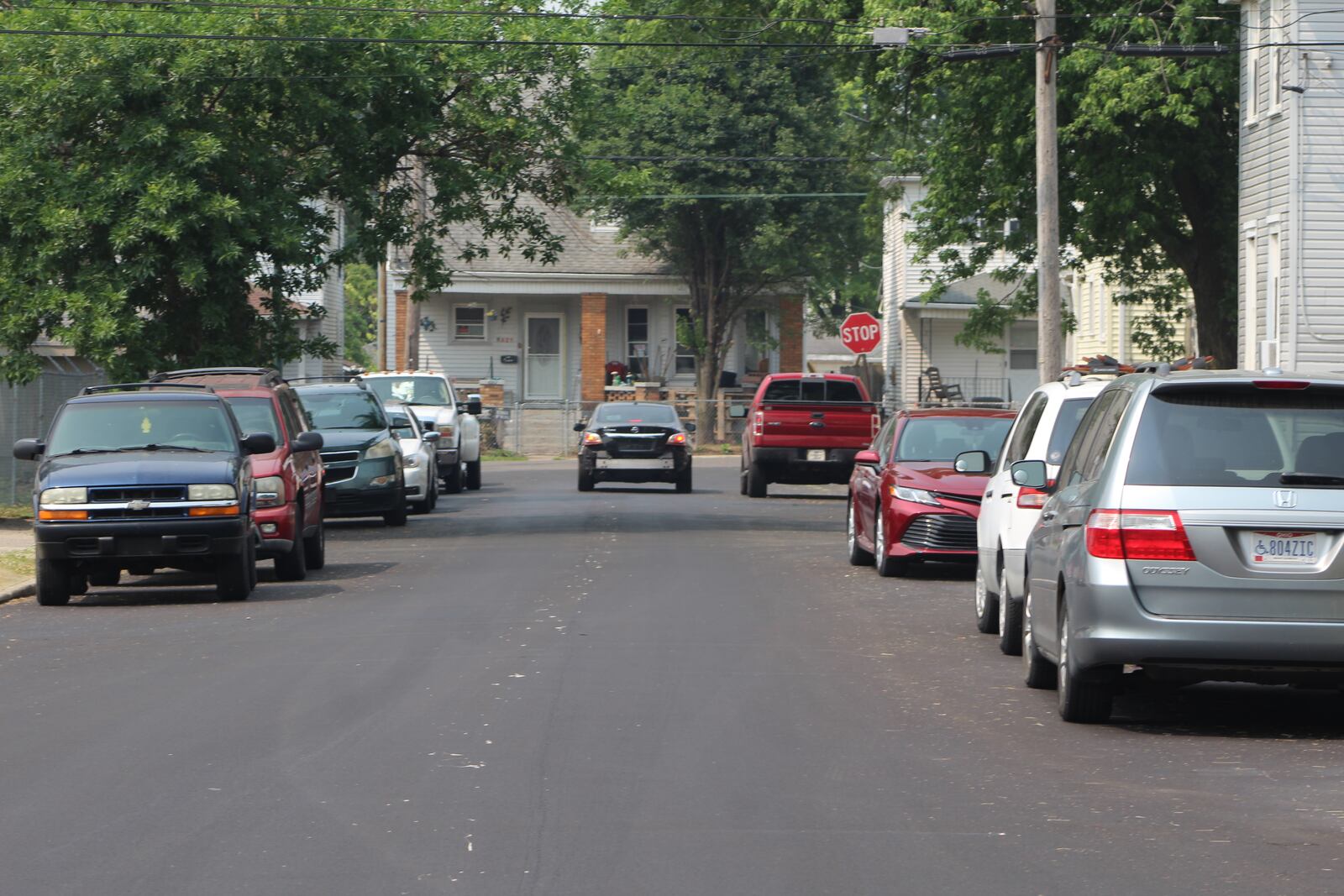 A car stops at a stop sign on Meridian Street in East Dayton. CORNELIUS FROLIK / STAFF