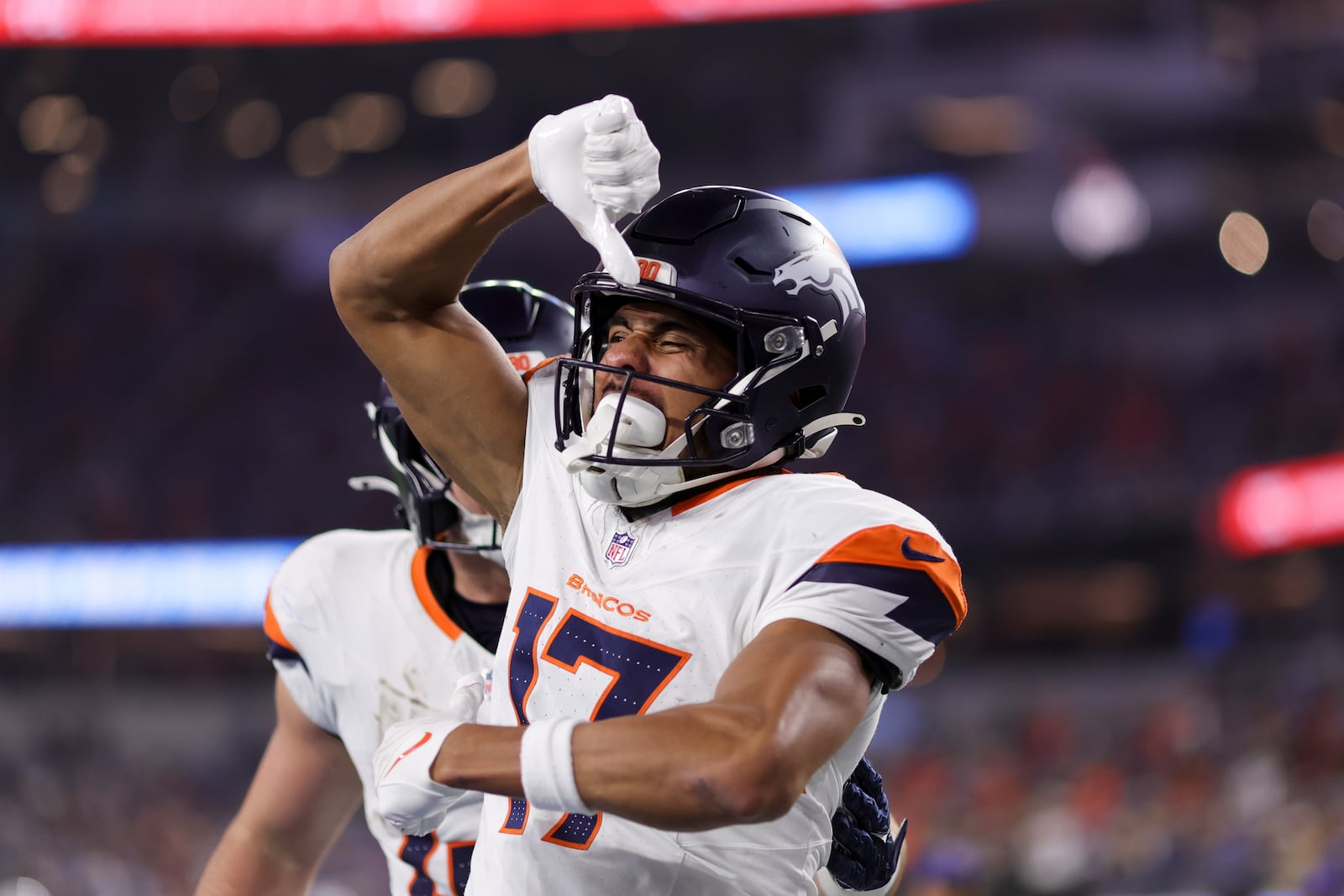 Denver Broncos wide receiver Devaughn Vele (17) celebrates after his touchdown catch during the first half an NFL football game against the Los Angeles Chargers, Thursday, Dec. 19, 2024, in Inglewood, Calif. (AP Photo/Ryan Sun)