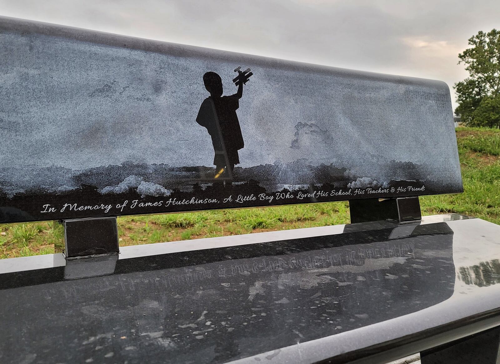 A bench in memory of James Hutchinson has been placed outside at Rosa Parks Elementary School in Middletown. NICK GRAHAM / STAFF