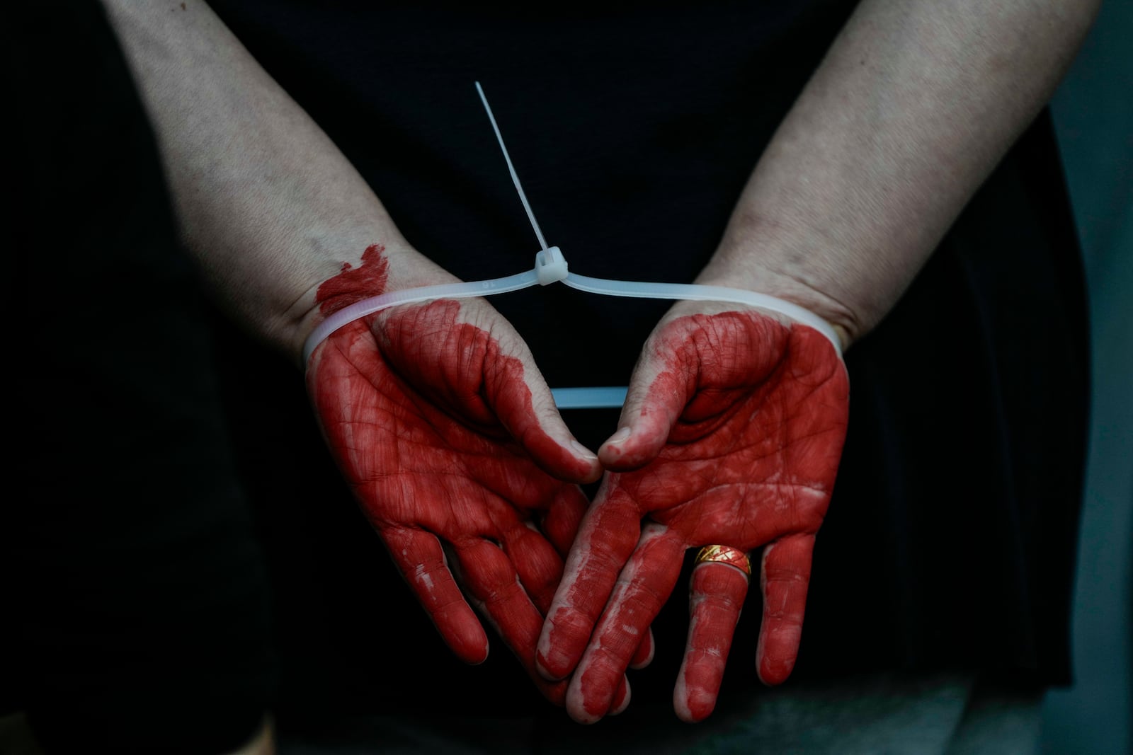 A woman demonstrator takes part in a performance calling for the release of hostage Naama Levy, held in the Gaza Strip by the Hamas militant group, in Tel Aviv, Israel, Saturday, Oct. 19, 2024. (AP Photo/Mahmoud Illean)