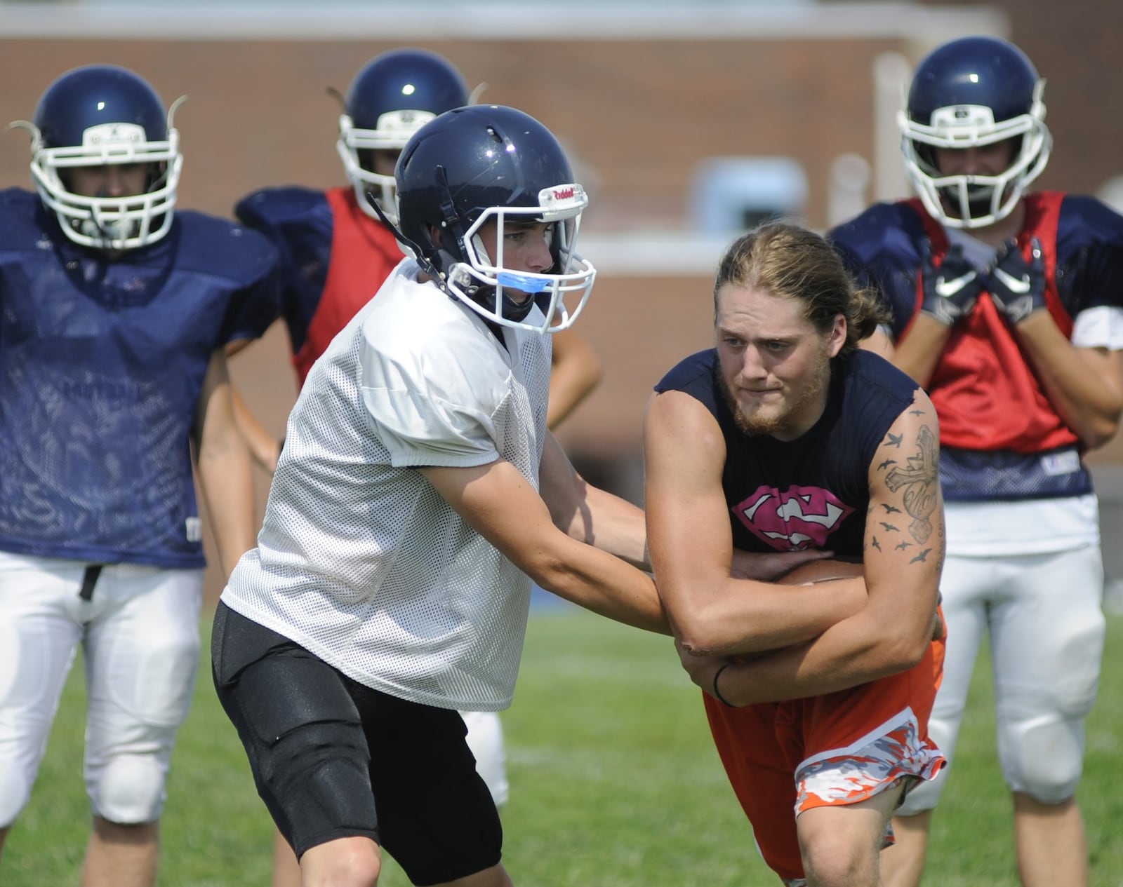 Valley View quarterback J.T. Ferguson and running back Stephen Gantert participate in a preseason football practice on Tuesday, Aug. 14, 2018. MARC PENDLETON / STAFF