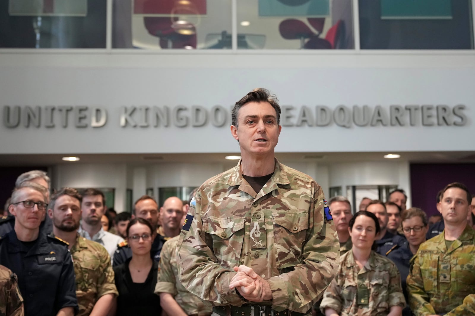 General Nick Perry Chief of Joint Operations, left speaks during a visit of Britain's Prime Minister Keir Starmer at a military base to meet planners mapping out next steps in the Coalition of the Willing in Northwood, London, Thursday, March 20, 2025.(AP Photo/Alastair Grant, Pool)