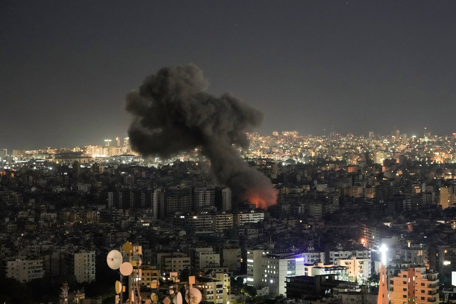 Flames and smoke rise form an Israeli airstrike on Dahiyeh, in the southern suburb of Beirut, Lebanon, Monday, Oct. 21, 2024. (AP Photo/Bilal Hussein)