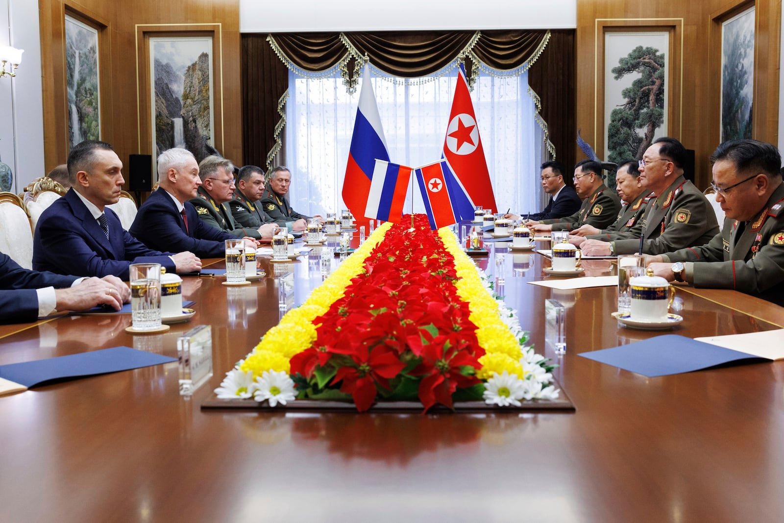 In this photo released by Russian Defense Ministry Press Service, Russian Defense Minister Andrei Belousov, second left, speaks with North Korean Defense Minister No Kwang Chol, second right, during their meeting in Pyongyang, North Korea, Friday, Nov. 29, 2024. (Vadim Savitsky, Russian Defense Ministry Press Service via AP)