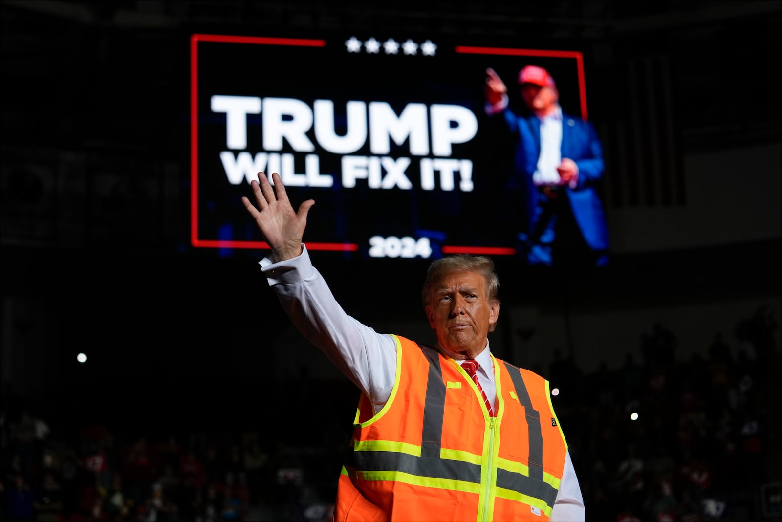 Republican presidential nominee former President Donald Trump waves after speaking at a campaign rally at Resch Center, Wednesday, Oct. 30, 2024, in Green Bay, Wis. (AP Photo/Julia Demaree Nikhinson)