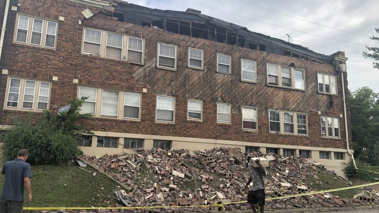 The facade of an apartment building on the 1100 block of Salem Avenue came tumbling down in July 2019. CORNELIUS FROLIK / STAFF