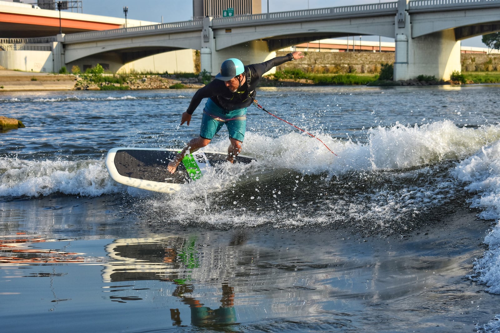 Shannon Thomas, of Surf Dayton, enjoys surfing the Art Wave in downtown Dayton - Contributed