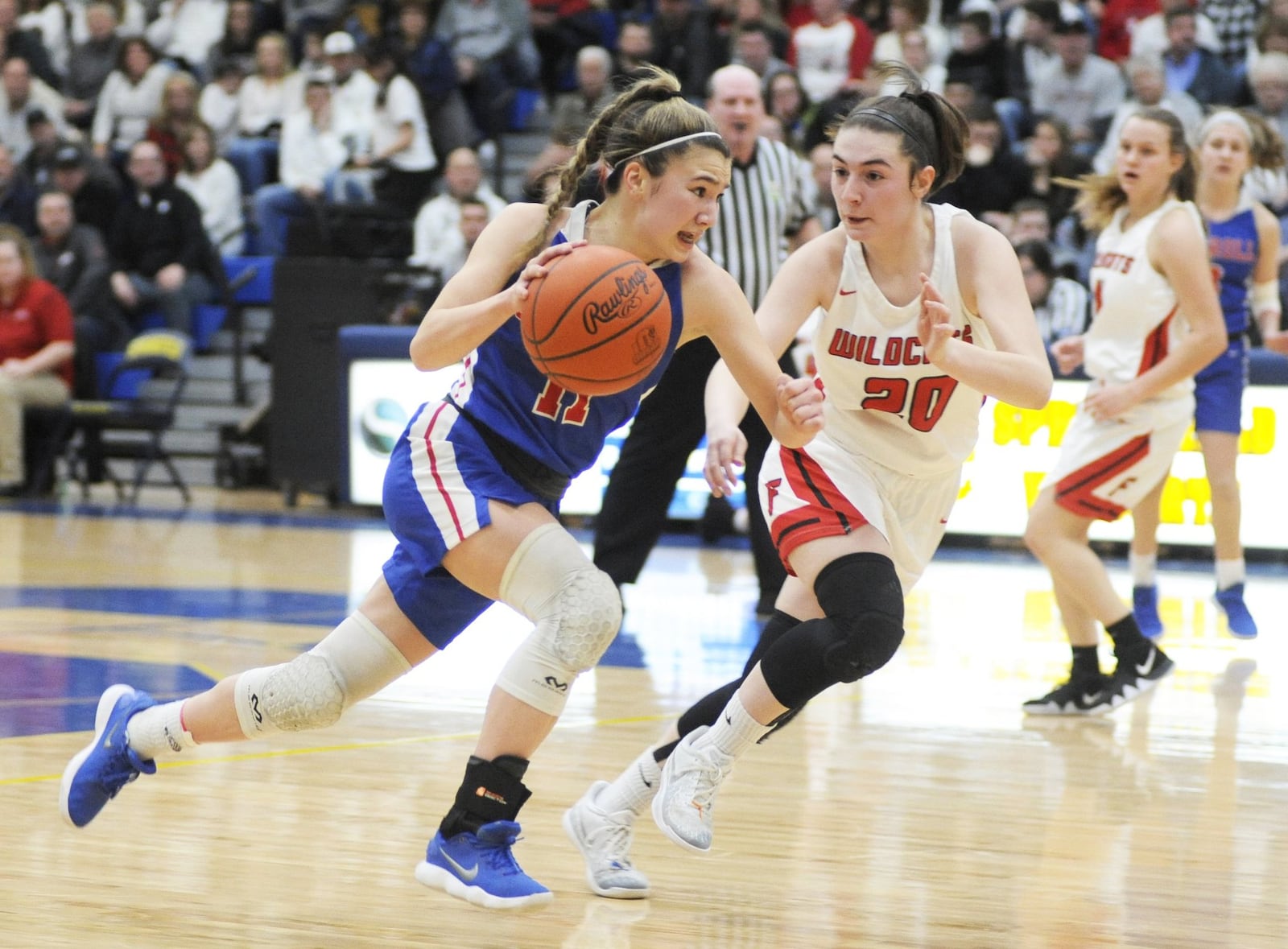 Ava Lickliter of Carroll (with ball) draws Franklin defender Skyler Weir. Carroll defeated Franklin 57-43 in a girls high school basketball D-II regional final at Springfield High School on Friday, March 8, 2019. MARC PENDLETON / STAFF