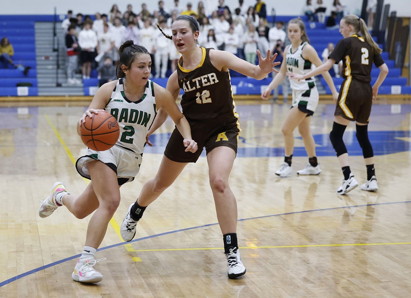 Badin's Mahya Lindesmith dribbles to the basket defended by Alter's Karlie Romer during their girls Division II regional final basketball game Friday, March 4, 2022 at Springfield High School in Springfield. Alter won 45-35. NICK GRAHAM/STAFF