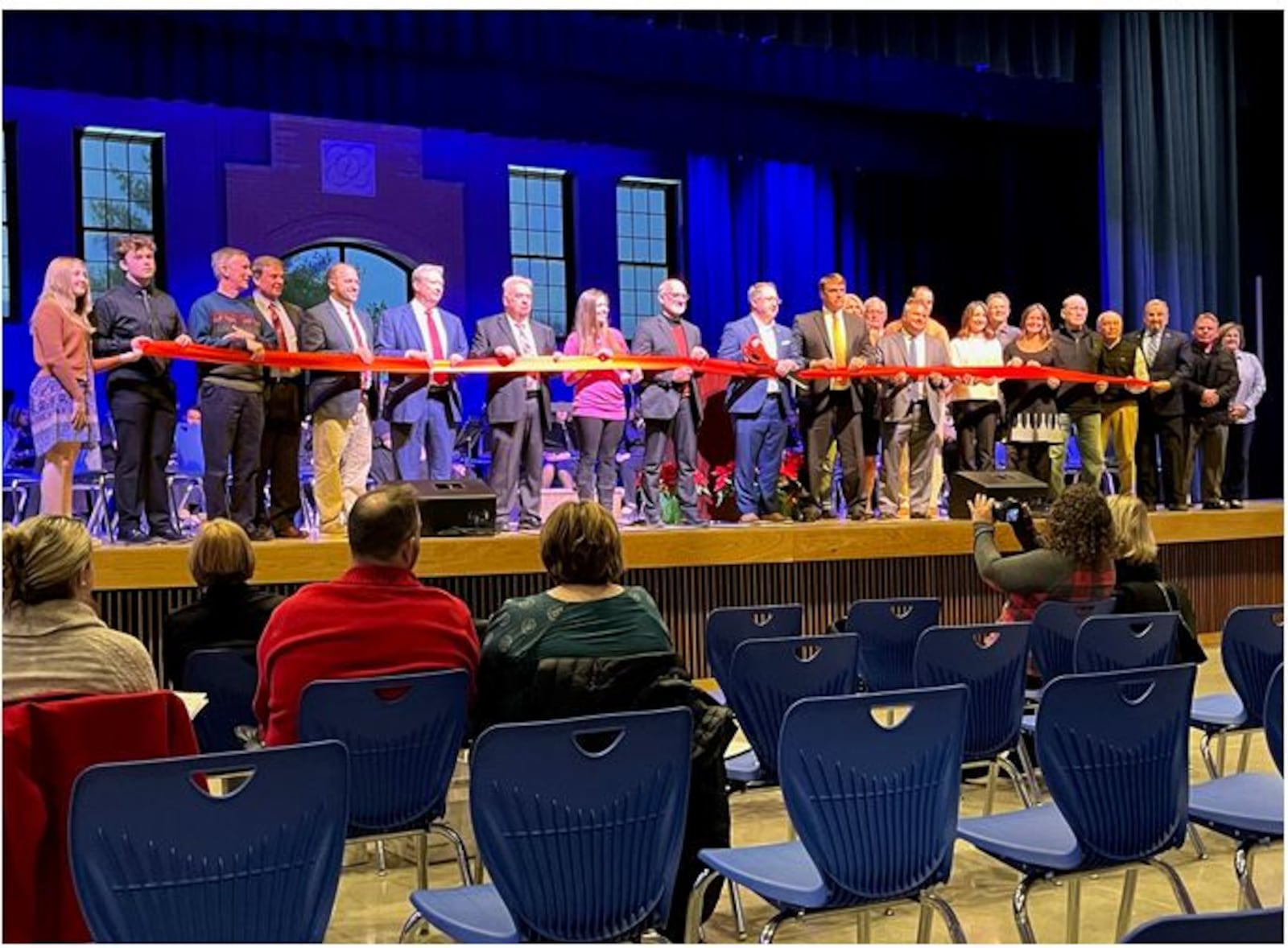 During the open house, Wayne Local School Board members, staff and students were assisted by Waynesville council members, Wayne Twp. trustees and other community members in the ribbon cutting ceremony. ED RICHTER/STAFF