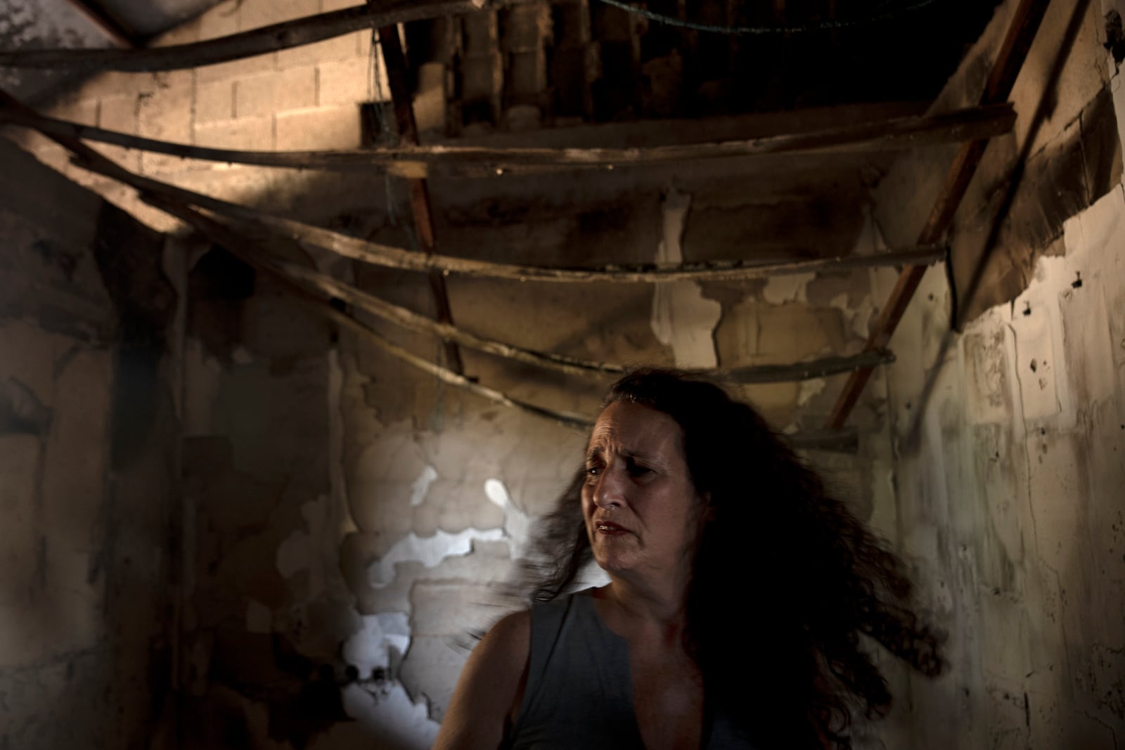 FILE - Hadas Kalderon is overcome by emotion in the ruins of her mother's home in Kibbutz Nir Oz, Israel, on Oct. 30, 2023. (AP Photo/Maya Alleruzzo, File)