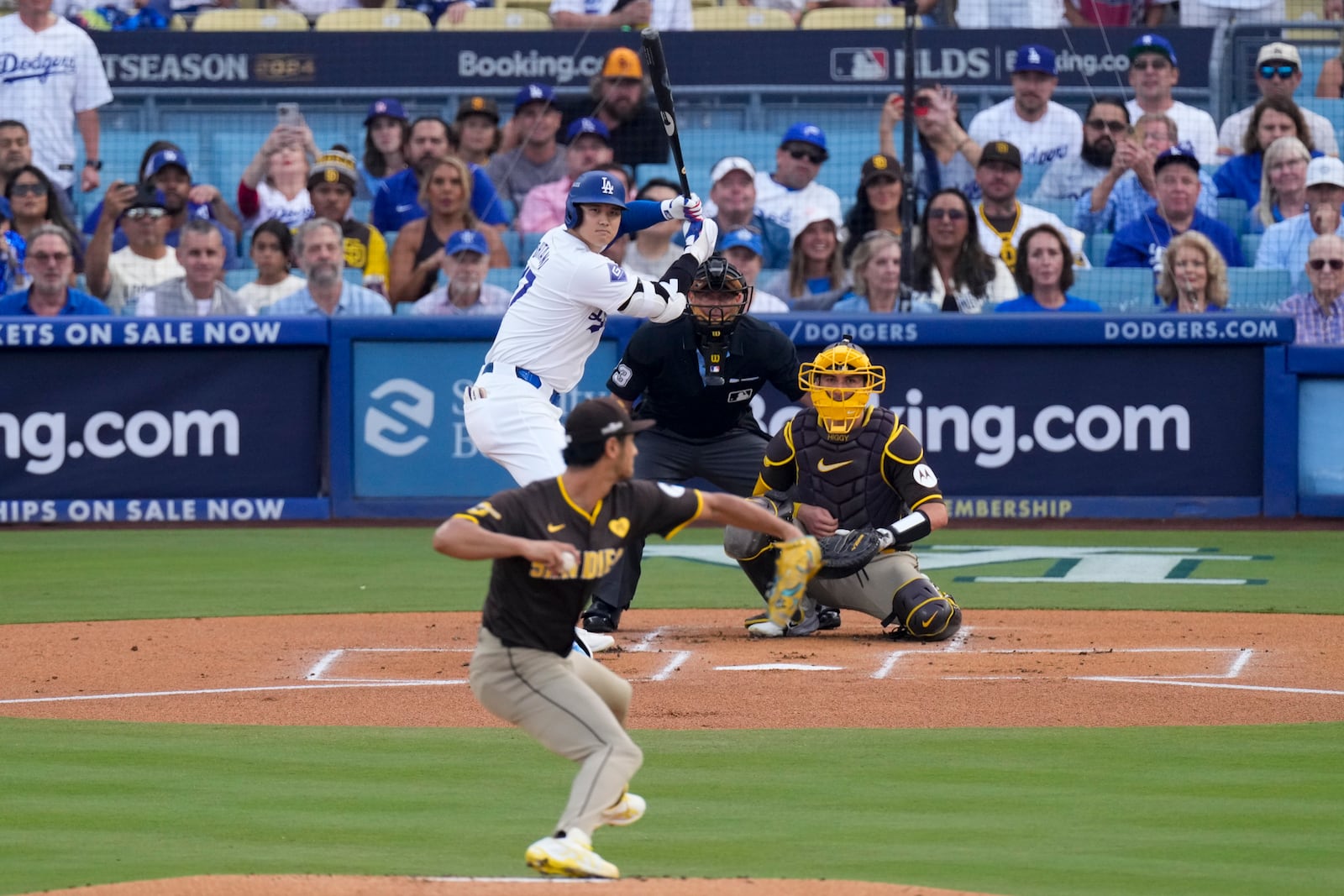 San Diego Padres pitcher Yu Darvish, bottom center, throws to Los Angeles Dodgers' Shohei Ohtani during the first inning in Game 5 of a baseball NL Division Series Friday, Oct. 11, 2024, in Los Angeles. (AP Photo/Mark J. Terrill)