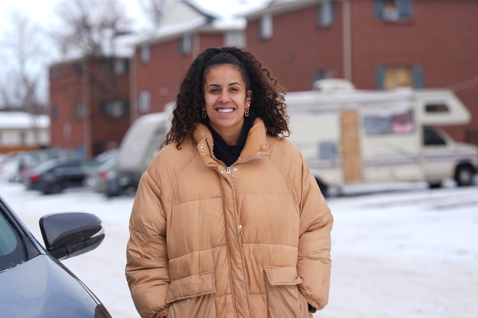 Katie Leonard, an organizer for the Party for Socialism and Liberation, is shown outside the apartment buildings at the center of an immigration controversy Tuesday, Jan. 21, 2025, in Aurora, Colo. (AP Photo/David Zalubowski)