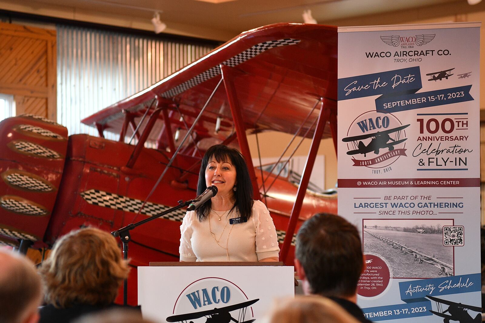 Nancy Royer of the WACO Museum and Aviation Learning Center in Troy talks about the 100th anniversary celebration and fly-in during an event in 2023. CONTRIBUTED PHOTO