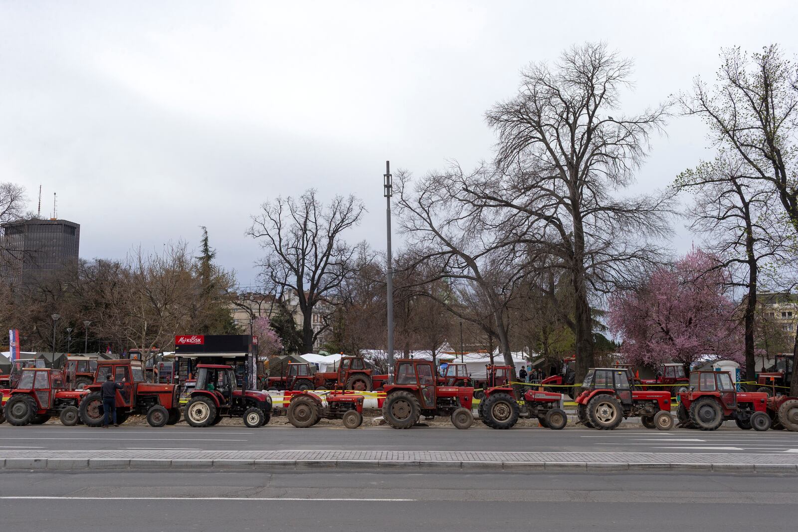 Tractors brought by supporters of the Serbian president Aleksandar Vucic are parked on the side of the street in Belgrade, Serbia, Friday, March 14, 2025, as the country prepares for a major anti-corruption rally this weekend. (AP Photo/Marko Drobnjakovic)