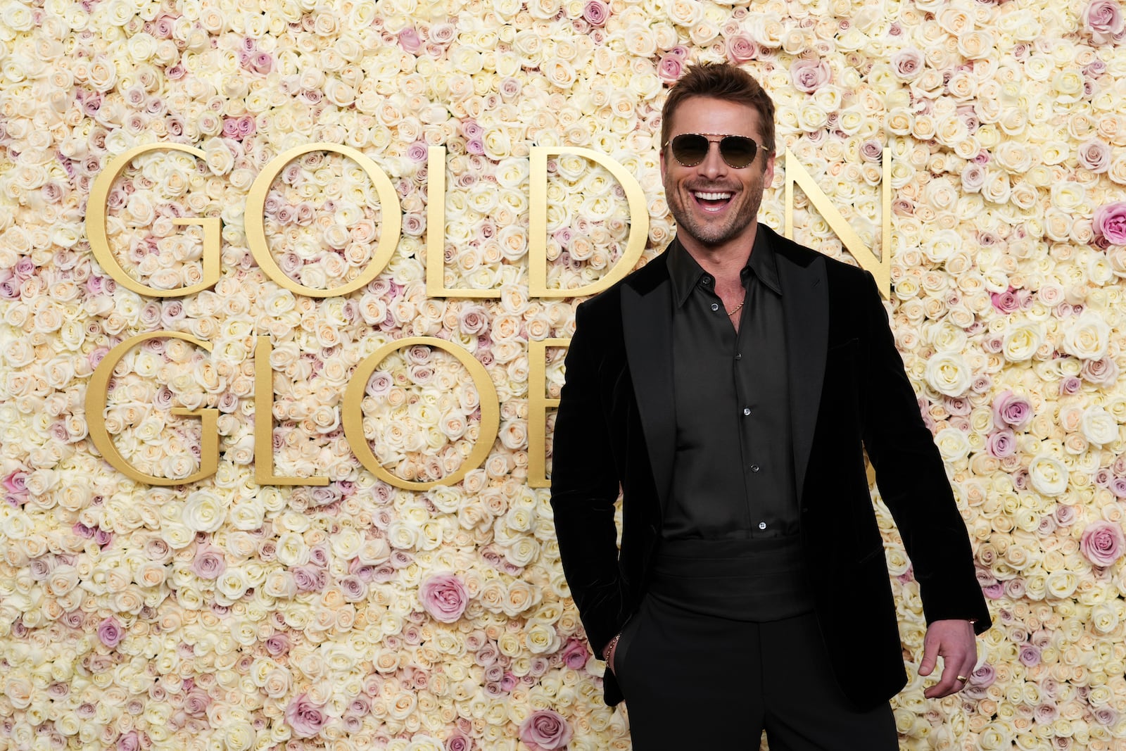 Glen Powell arrives at the 82nd Golden Globes on Sunday, Jan. 5, 2025, at the Beverly Hilton in Beverly Hills, Calif. (Photo by Jordan Strauss/Invision/AP)