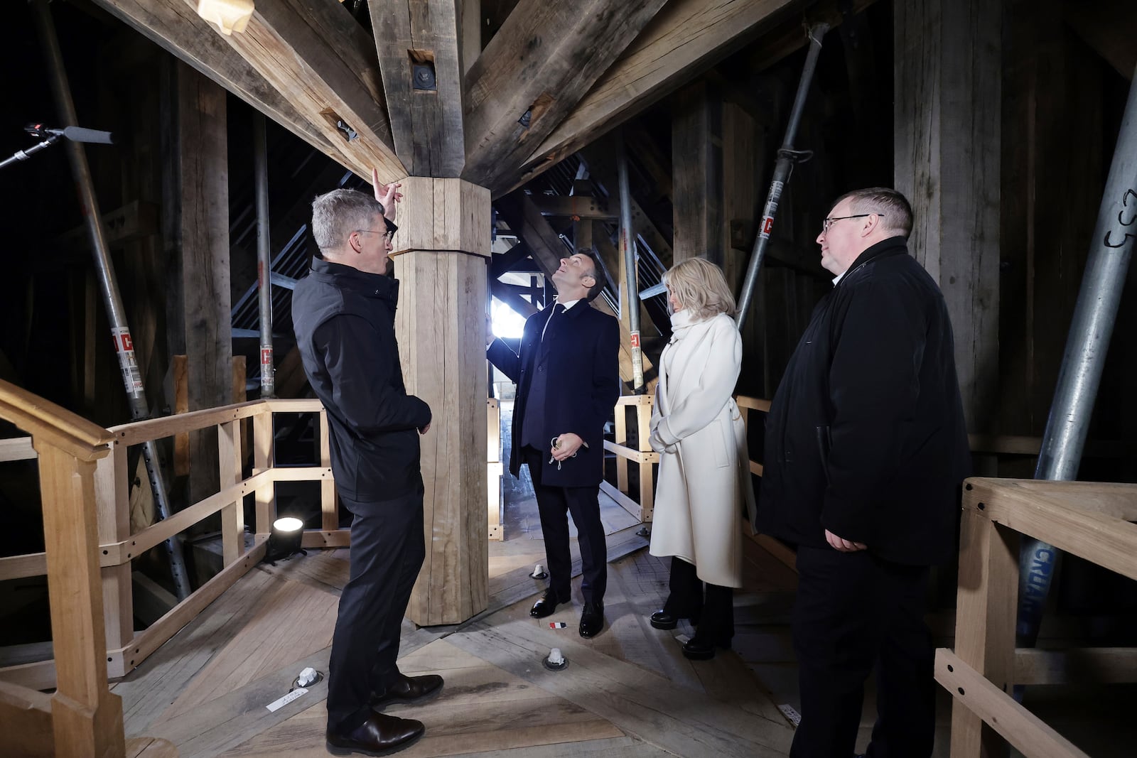 French President Emmanuel Macron, third right, and his wife Brigitte Macron visit the restored interiors of the Notre-Dame de Paris cathedral, Friday, Nov.29, 2024 in Paris. (Christophe Petit Tesson, Pool via AP)