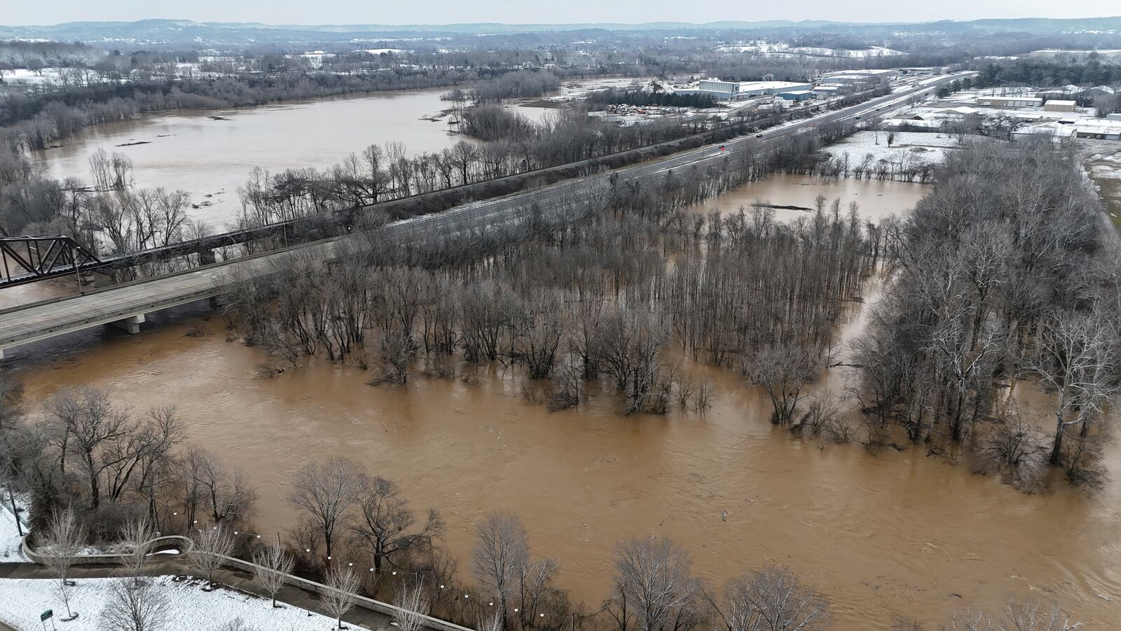 Portions of Basil Griffin Park in Bowling Green, Ky., Sunday, Feb. 16, 2025, sit submerged after heavy rainfall beginning early Saturday morning brought nearly five inches of rain to Warren County and after that snow blanketed the region. (Jack Dobbs/Daily News via AP)