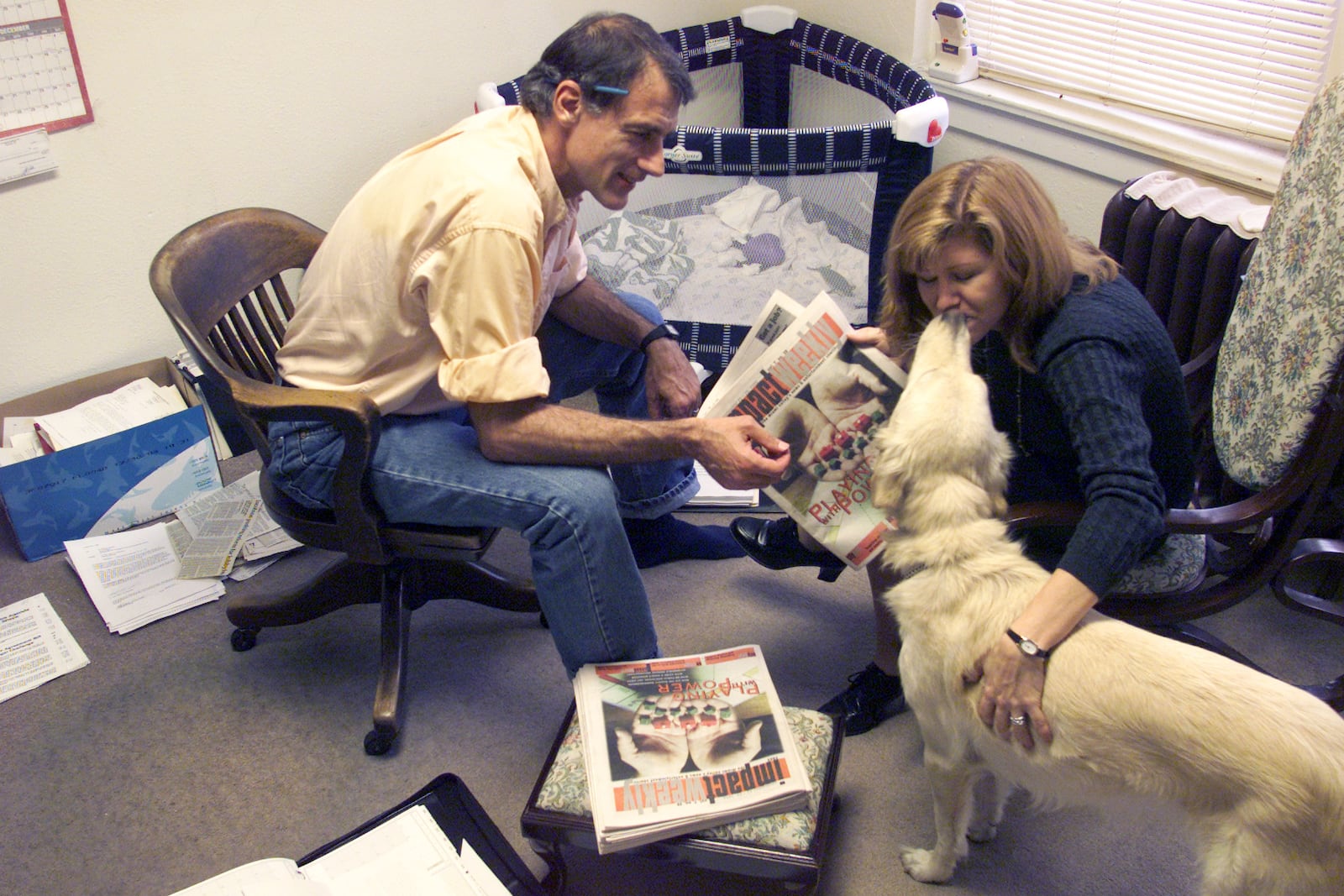 10/23/1999 archived photo: Jeff Epton and Marrianne McMullen work as co-publishers at Impact Weekly where they used to be owners. The couple also bring a part of their home life with them to work, including their dog Idgie and sometimes their baby. 