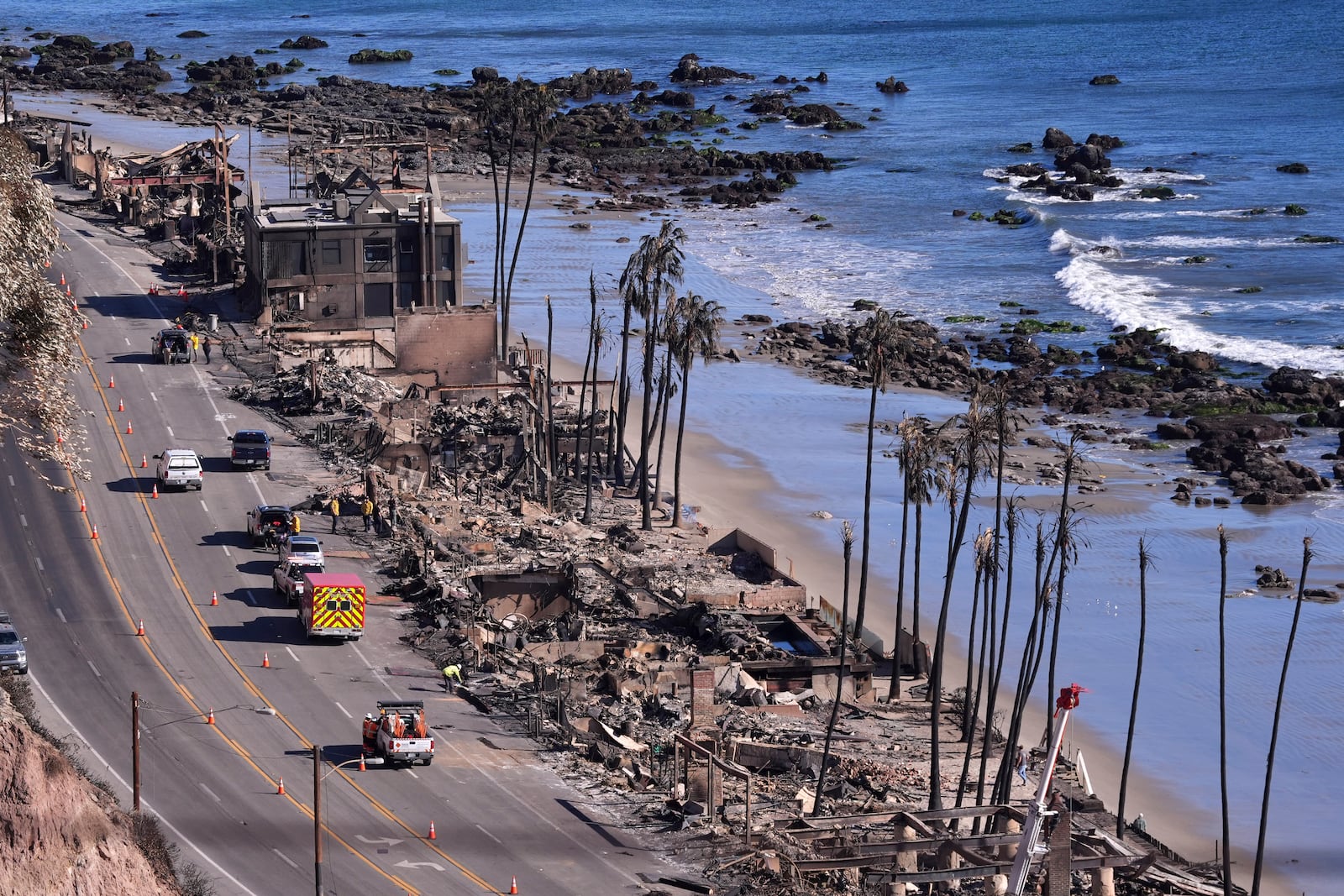 Homes along Pacific Coast Highway are seen burn out from the Palisades Fire, Sunday, Jan. 12, 2025, in Malibu, Calif. (AP Photo/Mark J. Terrill)