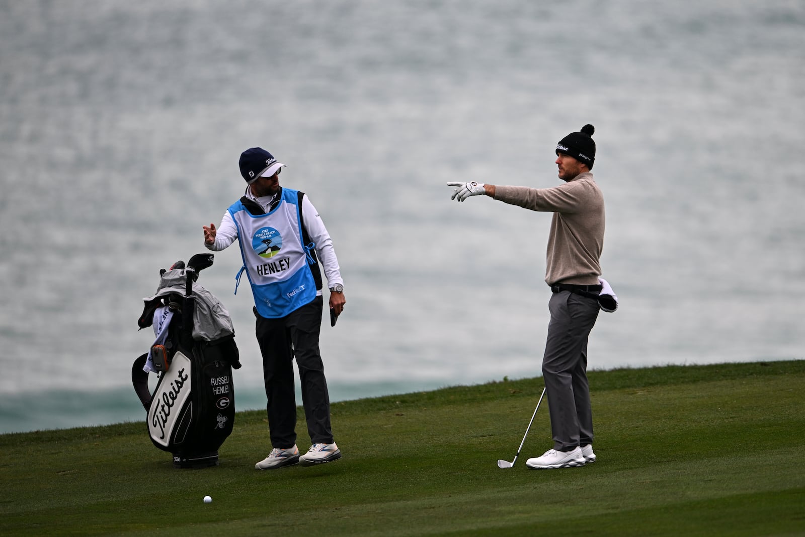 Russell Henley points as he looks down the 10th fairway at Pebble Beach Golf Links during the second round of the AT&T Pebble Beach Pro-Am golf tournament, Friday, Jan. 31, 2025, in Pebble Beach, Calif. (AP Photo/Nic Coury)