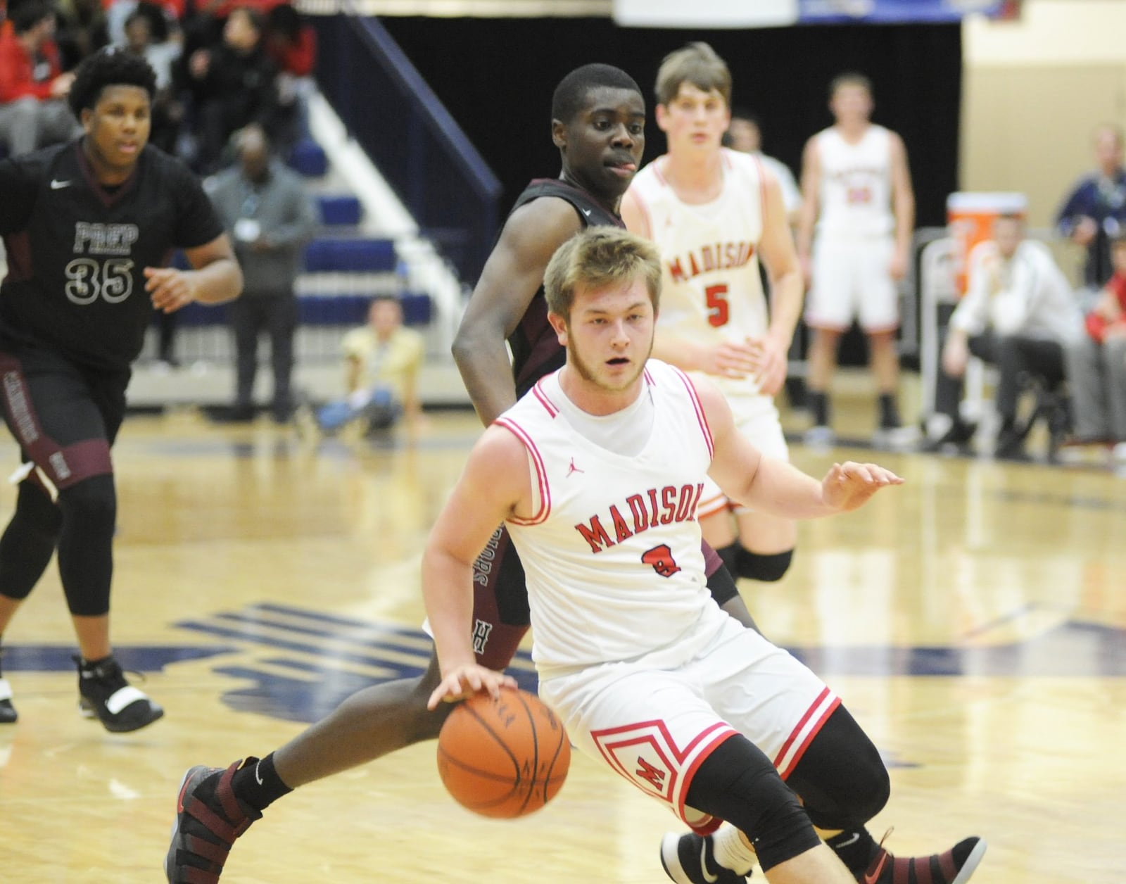 Madison's Mason Whiteman dribbles down the floor against Canal Winchester Harvest Prep during Monday night's Premier Health Flyin' to the Hoop at Fairmont's Trent Arena. Harvest Prep won 79-56. MARC PENDLETON/STAFF