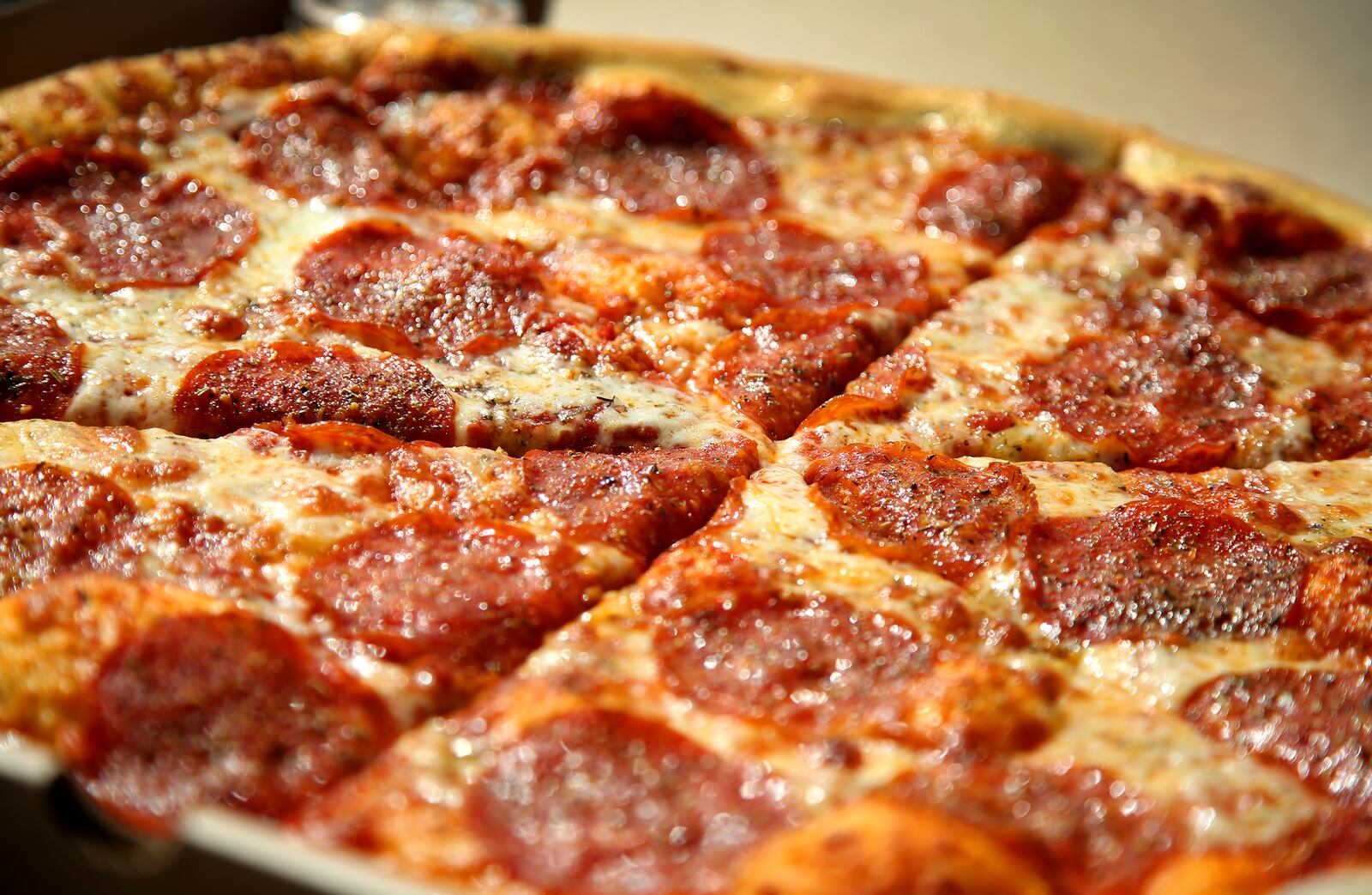 The Pizza Bandit is a New York style pizza truck that can found at the Yellow Cab Tavern in Dayton.  The signature dish is an 18-inch pepporoni pizza.  LISA POWELL / STAFF