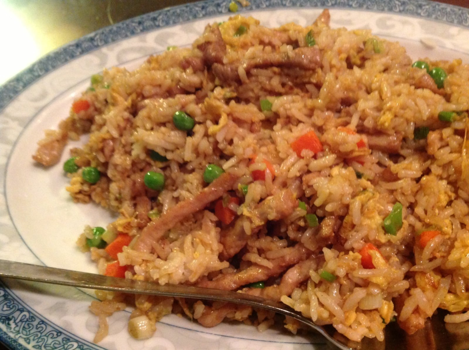 While most local diners gravitate towards more familiar items like the pork fried rice pictured, China Cottage offers a traditional Chinese menu with more exotic dishes like mala conch, jelly fish, simmered sea cucumber and rock salt prawns. (Staff photo by Amelia Robinson)