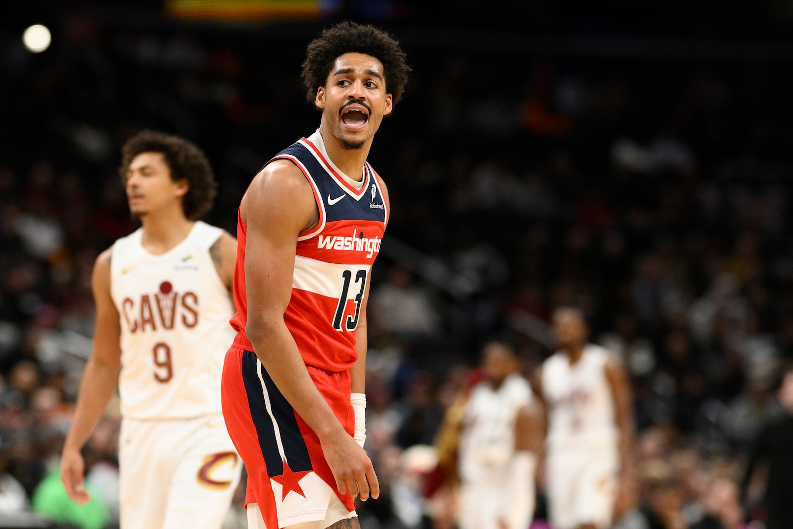 Washington Wizards guard Jordan Poole (13) reacts after a foul was called on his team during the first half of an NBA basketball game against the Cleveland Cavaliers, Friday, Feb. 7, 2025, in Washington. (AP Photo/Nick Wass)