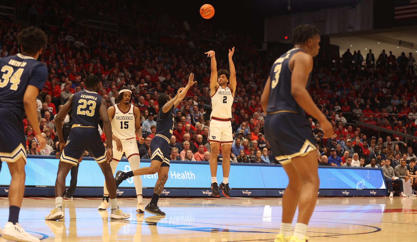 Dayton's Nate Santos scores against George Washington on Tuesday, Jan. 30, 2024, at UD Arena. David Jablonski/Staff