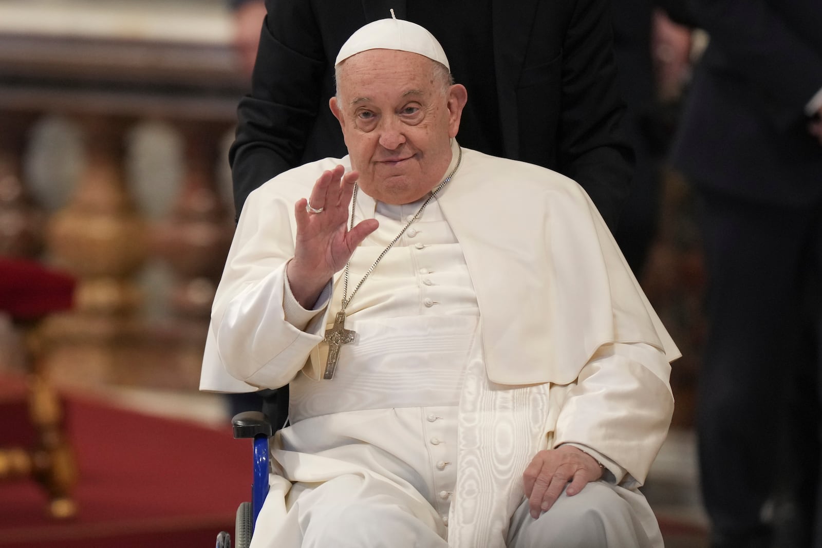 Pope Francis leaves after he presided over a mass on the occasion of the Youth Day, in St. Peter's Basilica at the Vatican, Sunday, Nov. 24, 2024. (AP Photo/Andrew Medichini)