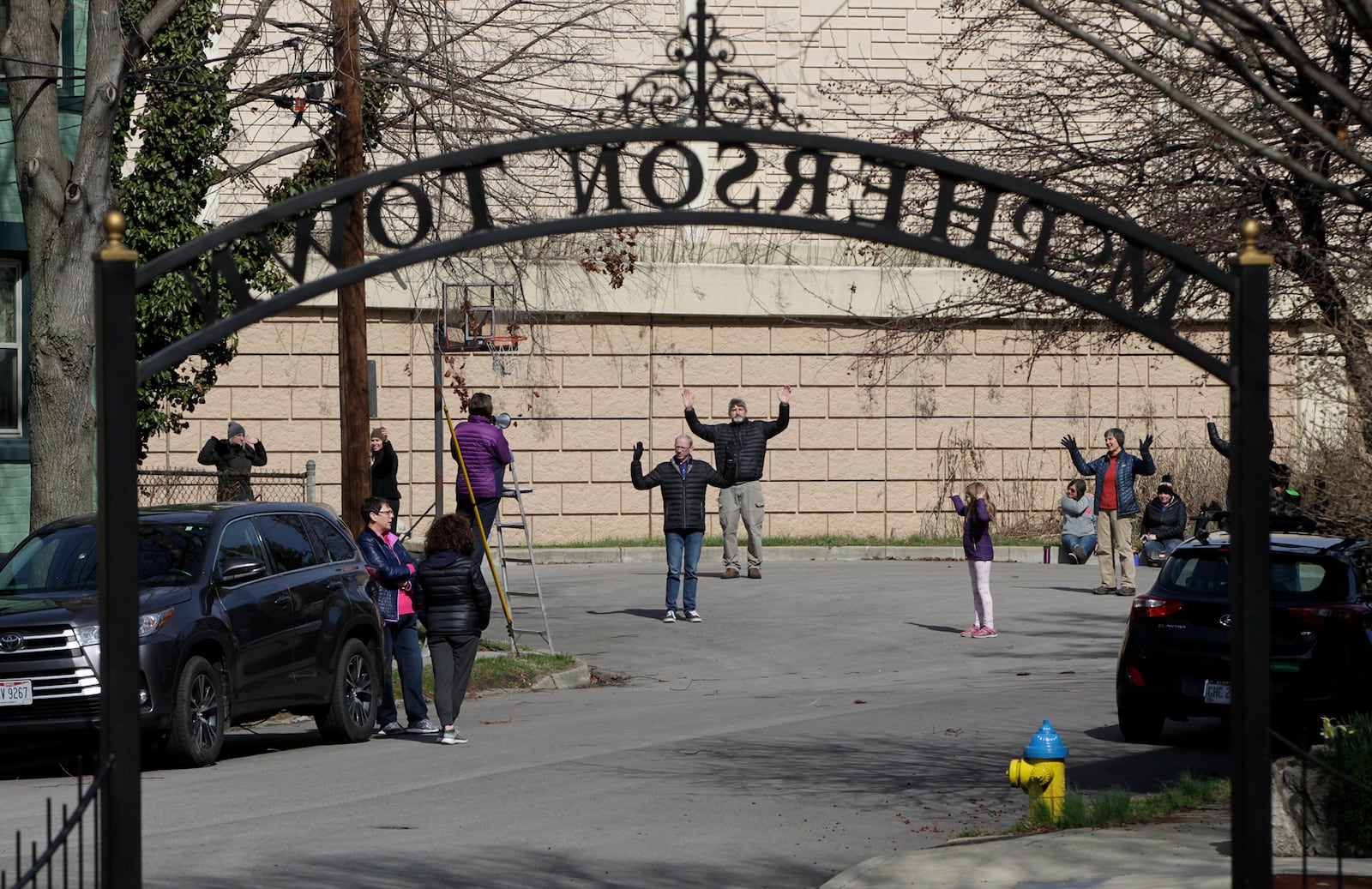 Residents of Dayton’s McPherson Town Historic District are finding creative ways to get outside while practicing social distancing. Neighborhood resident Donna LaChance led more than 25 people of all ages  in a game of outdoor Simon Says. The historic district also turned into an outdoor word game. Residents wrote scrambled words in chalk on the sidewalks outside their homes for neighbors to decipher. CHRIS STEWART / STAFF