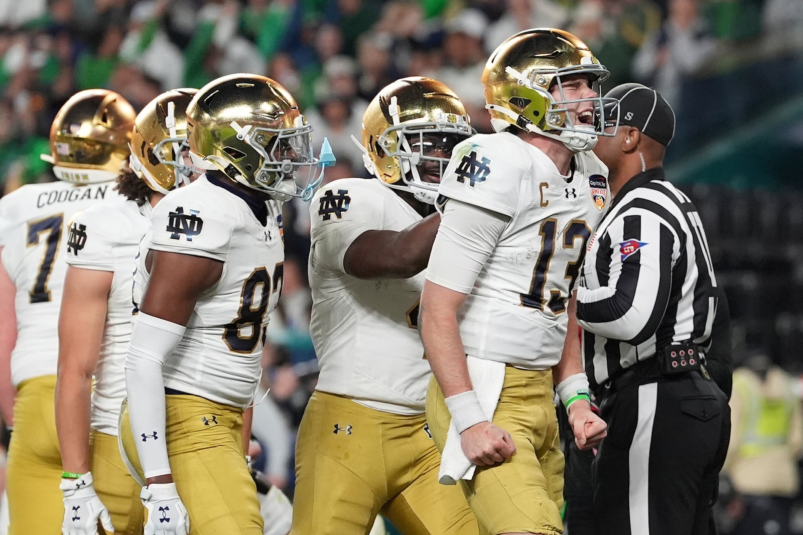 Notre Dame quarterback Riley Leonard (13) celebrates after scoring a touchdown during the second half of the Orange Bowl NCAA College Football Playoff semifinal game against Penn State, Thursday, Jan. 9, 2025, in Miami Gardens, Fla. (AP Photo/Rebecca Blackwell)